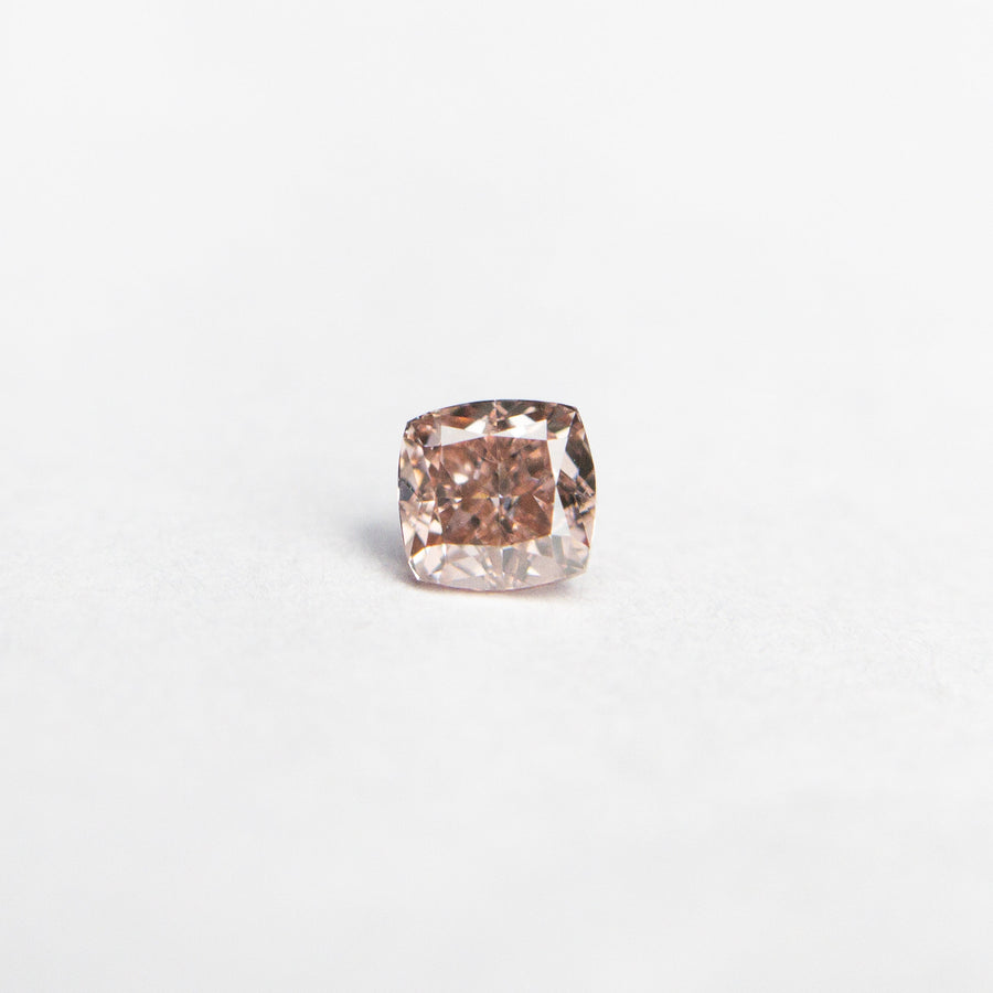 The 0.13ct 2.79x2.72x1.87mm GIA Fancy Orangy Pink Cushion Brilliant 🇦🇺 24100-01 by East London jeweller Rachel Boston | Discover our collections of unique and timeless engagement rings, wedding rings, and modern fine jewellery. - Rachel Boston Jewellery