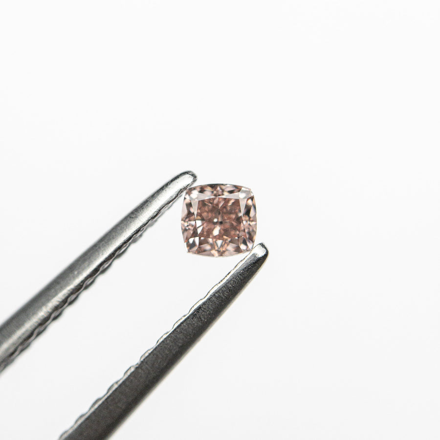The 0.13ct 2.79x2.72x1.87mm GIA Fancy Orangy Pink Cushion Brilliant 🇦🇺 24100-01 by East London jeweller Rachel Boston | Discover our collections of unique and timeless engagement rings, wedding rings, and modern fine jewellery. - Rachel Boston Jewellery