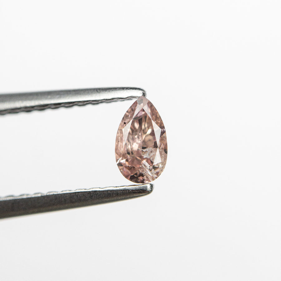 The 0.26ct 4.93x2.92x2.15mm Fancy Pink Pear Brilliant 24106-01 by East London jeweller Rachel Boston | Discover our collections of unique and timeless engagement rings, wedding rings, and modern fine jewellery. - Rachel Boston Jewellery
