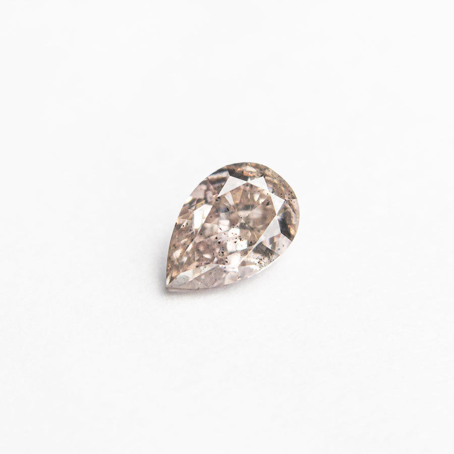 The 0.34ct 5.35x3.56x2.35mm I1 Fancy Pink-Brown Pear Brilliant 24119-01 by East London jeweller Rachel Boston | Discover our collections of unique and timeless engagement rings, wedding rings, and modern fine jewellery. - Rachel Boston Jewellery