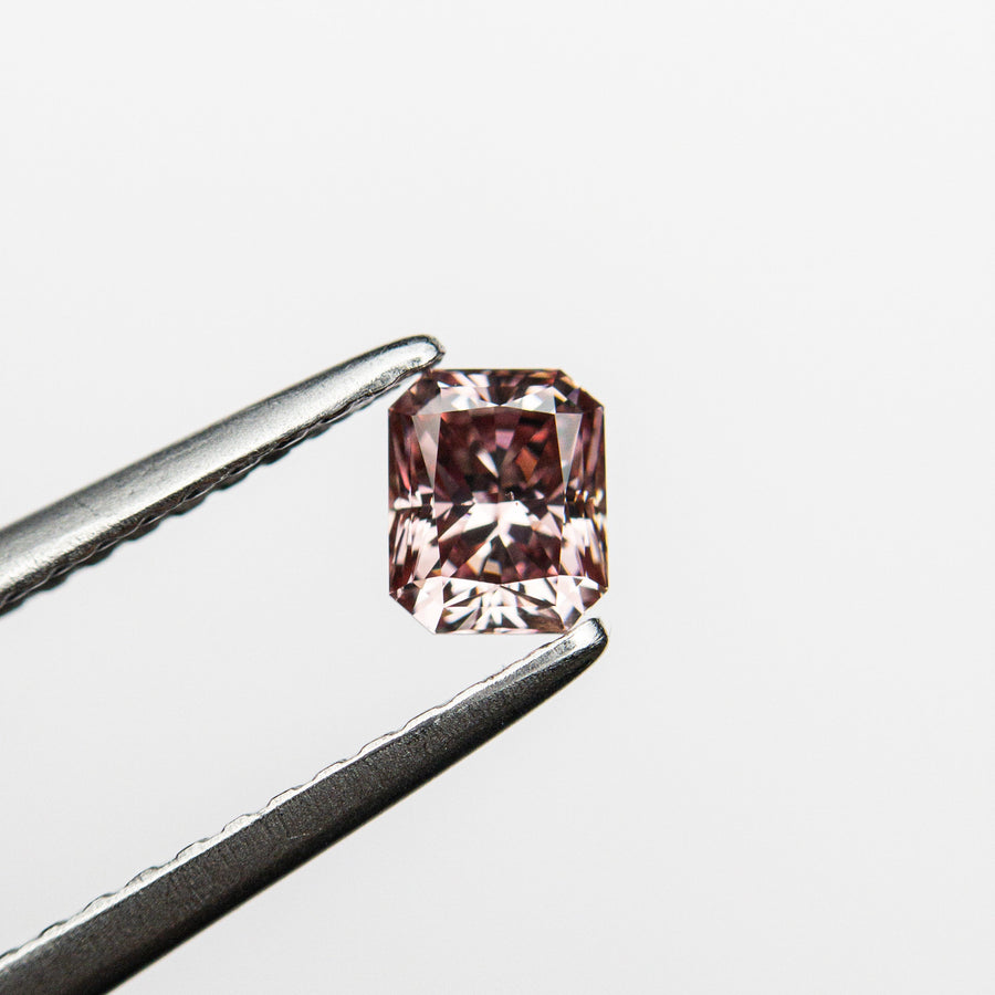 The 0.35ct 4.40x3.60x2.73mm GIA SI1 Fancy Deep Pink Cut Corner Rectangle Brilliant 24155-01 by East London jeweller Rachel Boston | Discover our collections of unique and timeless engagement rings, wedding rings, and modern fine jewellery. - Rachel Boston Jewellery