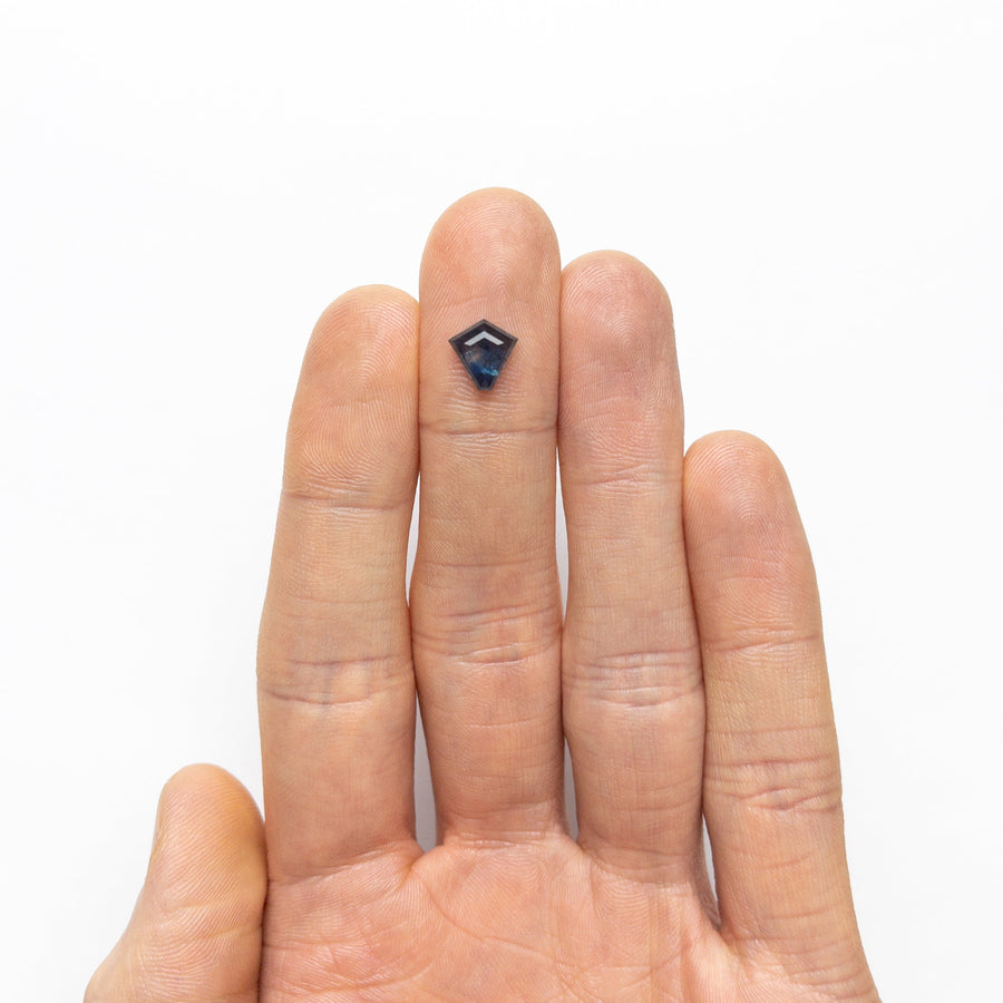 The 1.74ct 8.30x8.21x3.19mm Shield Step Cut Sapphire 22266-25 by East London jeweller Rachel Boston | Discover our collections of unique and timeless engagement rings, wedding rings, and modern fine jewellery. - Rachel Boston Jewellery