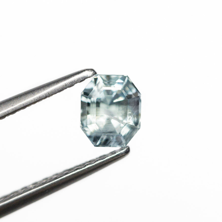 The 1.09ct 5.52x4.64x4.50mm Cut Corner Rectangle Step Cut Sapphire 23700-21 by East London jeweller Rachel Boston | Discover our collections of unique and timeless engagement rings, wedding rings, and modern fine jewellery. - Rachel Boston Jewellery