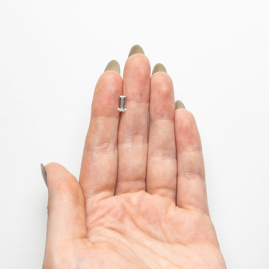 The 0.85ct 7.97x3.98x2.54mm Cut Corner Rectangle Step Cut Sapphire 23773-02 by East London jeweller Rachel Boston | Discover our collections of unique and timeless engagement rings, wedding rings, and modern fine jewellery. - Rachel Boston Jewellery