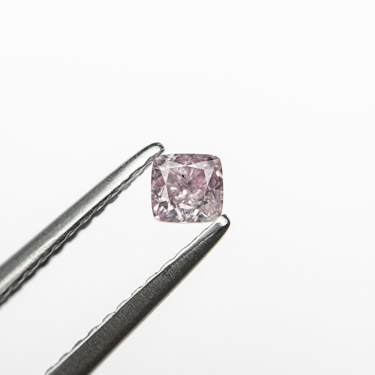 The 0.20ct 3.16x3.01x2.15mm GIA SI2 Fancy Purple-Pink Cushion Brilliant 🇦🇺 24098-01 by East London jeweller Rachel Boston | Discover our collections of unique and timeless engagement rings, wedding rings, and modern fine jewellery.