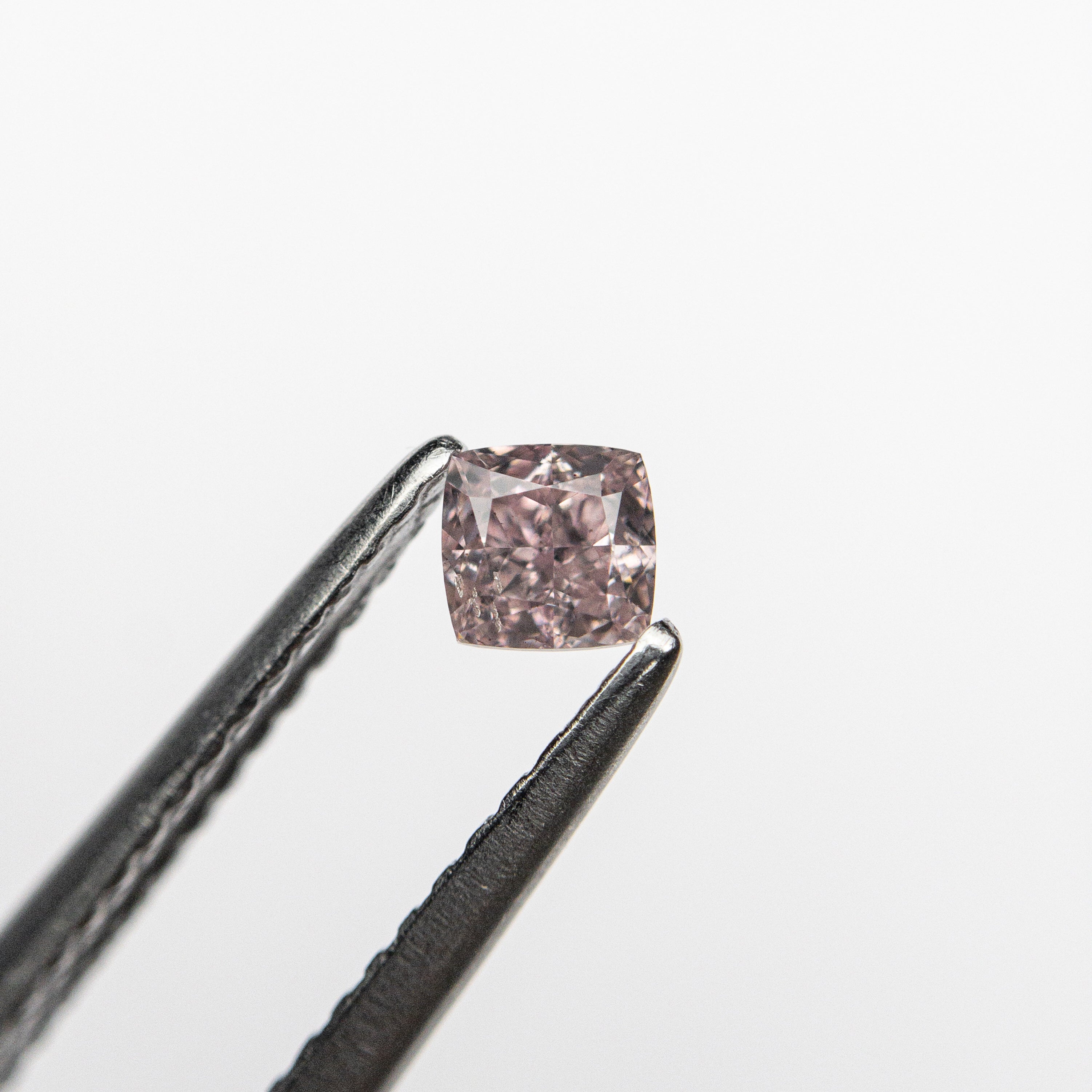 The 0.20ct 3.16x3.06x2.13mm GIA SI2 Fancy Pink Cushion Brilliant 🇦🇺 24099-01 by East London jeweller Rachel Boston | Discover our collections of unique and timeless engagement rings, wedding rings, and modern fine jewellery.