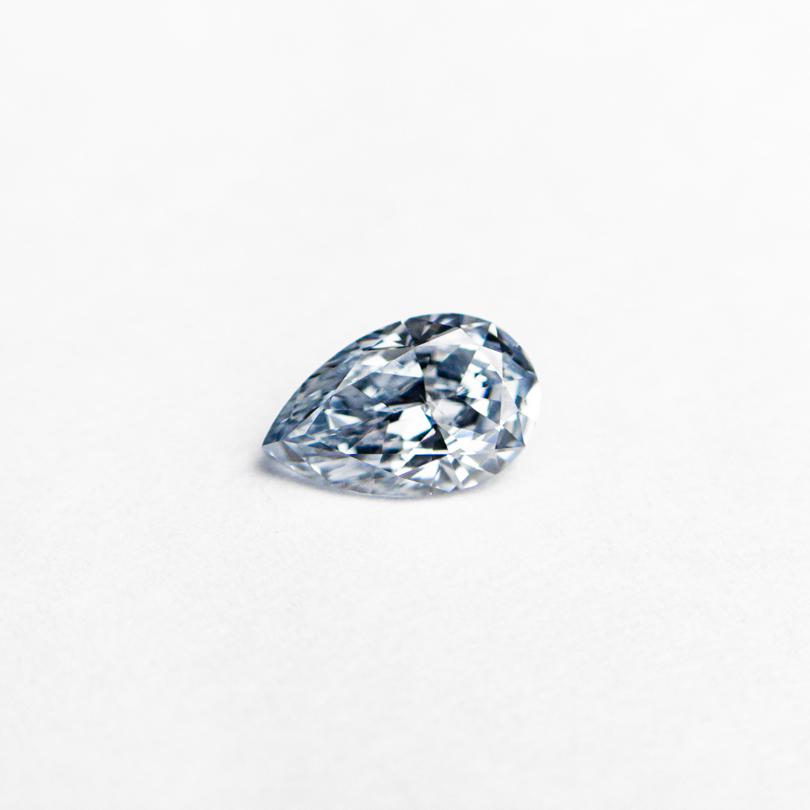 The 0.20ct 5.17x3.28x1.78mm GIA SI1 Fancy Intense Blue Pear Brilliant 24134-01 by East London jeweller Rachel Boston | Discover our collections of unique and timeless engagement rings, wedding rings, and modern fine jewellery.