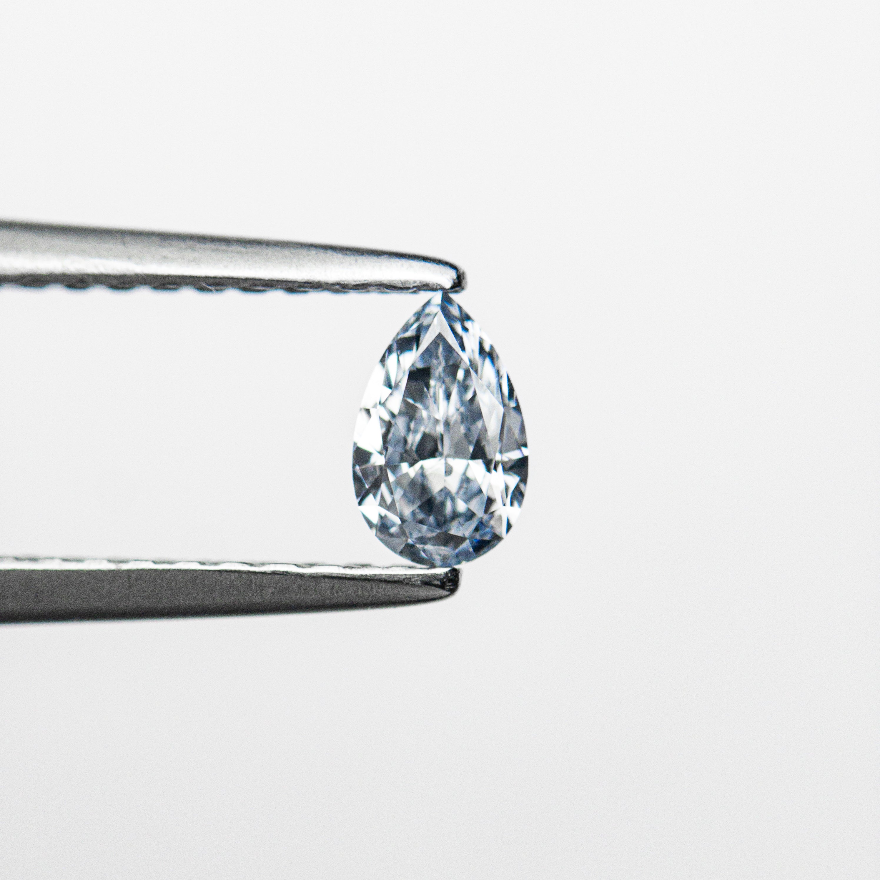 The 0.20ct 5.17x3.28x1.78mm GIA SI1 Fancy Intense Blue Pear Brilliant 24134-01 by East London jeweller Rachel Boston | Discover our collections of unique and timeless engagement rings, wedding rings, and modern fine jewellery.
