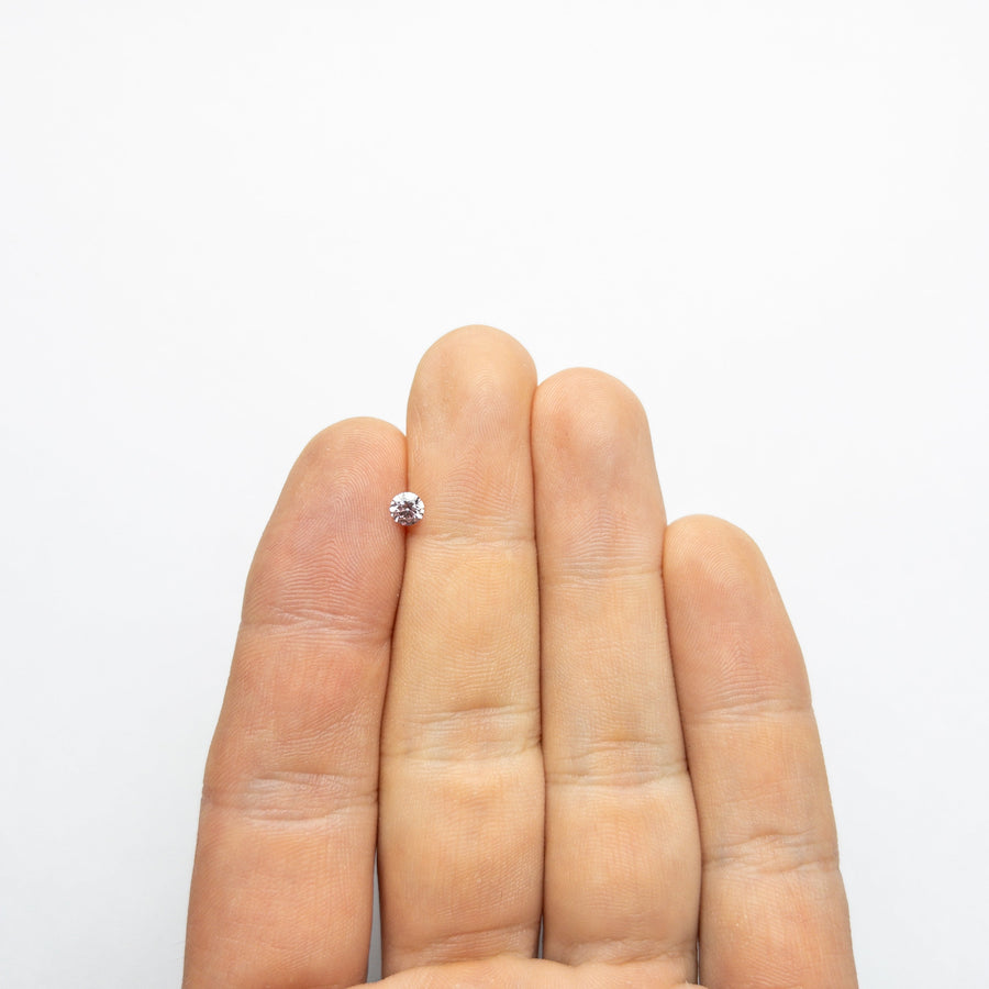 The 0.25ct 4.11x4.09x2.47mm GIA I1 Fancy Purple-Pink Round Brilliant 24143-01 by East London jeweller Rachel Boston | Discover our collections of unique and timeless engagement rings, wedding rings, and modern fine jewellery. - Rachel Boston Jewellery