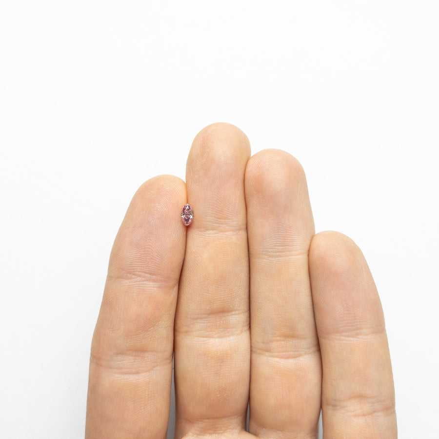 The 0.29ct 5.70x3.27x2.29mm GIA I1 Fancy Intense Purplish Pink Marquise Brilliant 24148-01 by East London jeweller Rachel Boston | Discover our collections of unique and timeless engagement rings, wedding rings, and modern fine jewellery. - Rachel Boston Jewellery