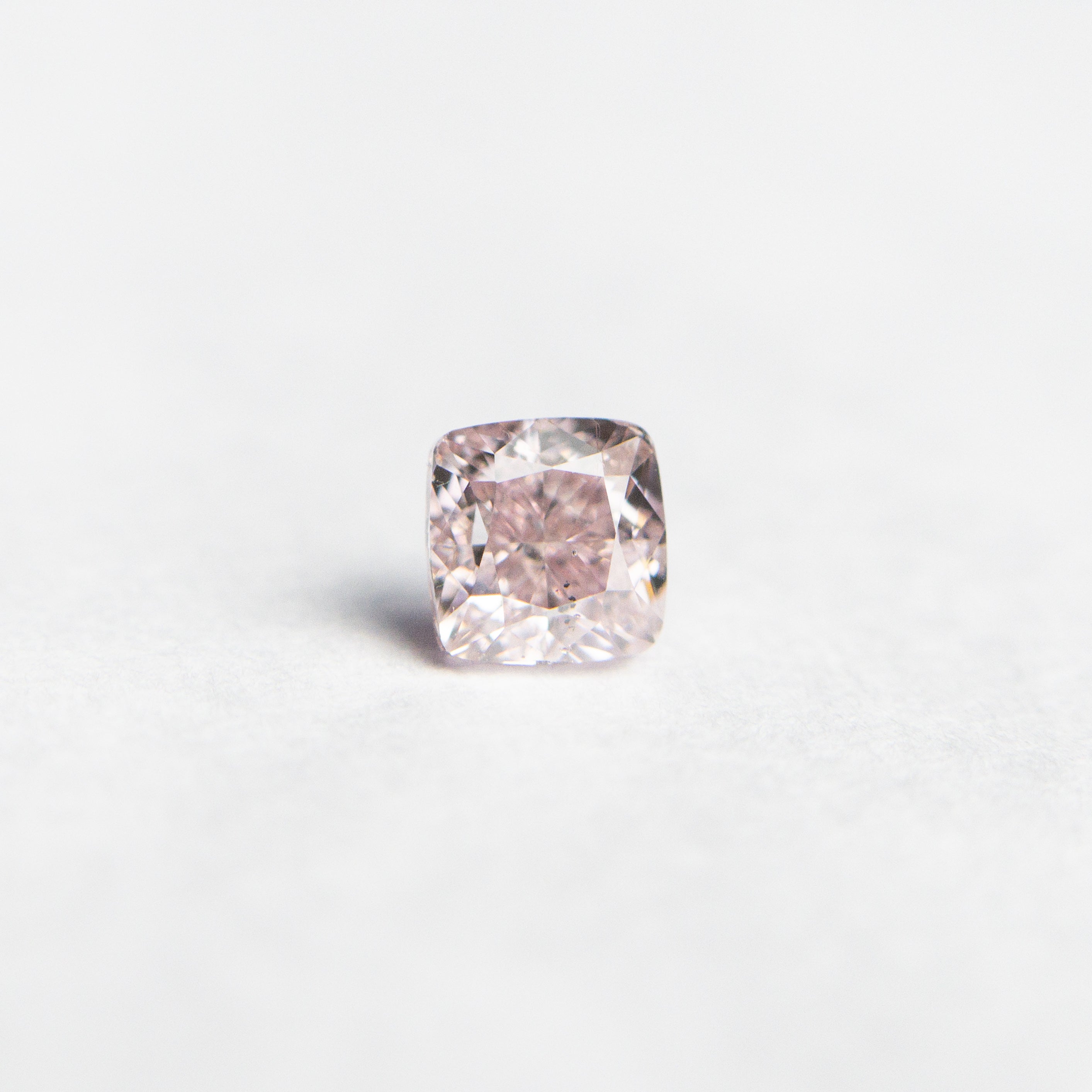 The 0.30ct 3.44x3.36x2.63mm GIA SI1 Fancy Pink Cushion Brilliant 🇦🇺 24103-01 by East London jeweller Rachel Boston | Discover our collections of unique and timeless engagement rings, wedding rings, and modern fine jewellery.