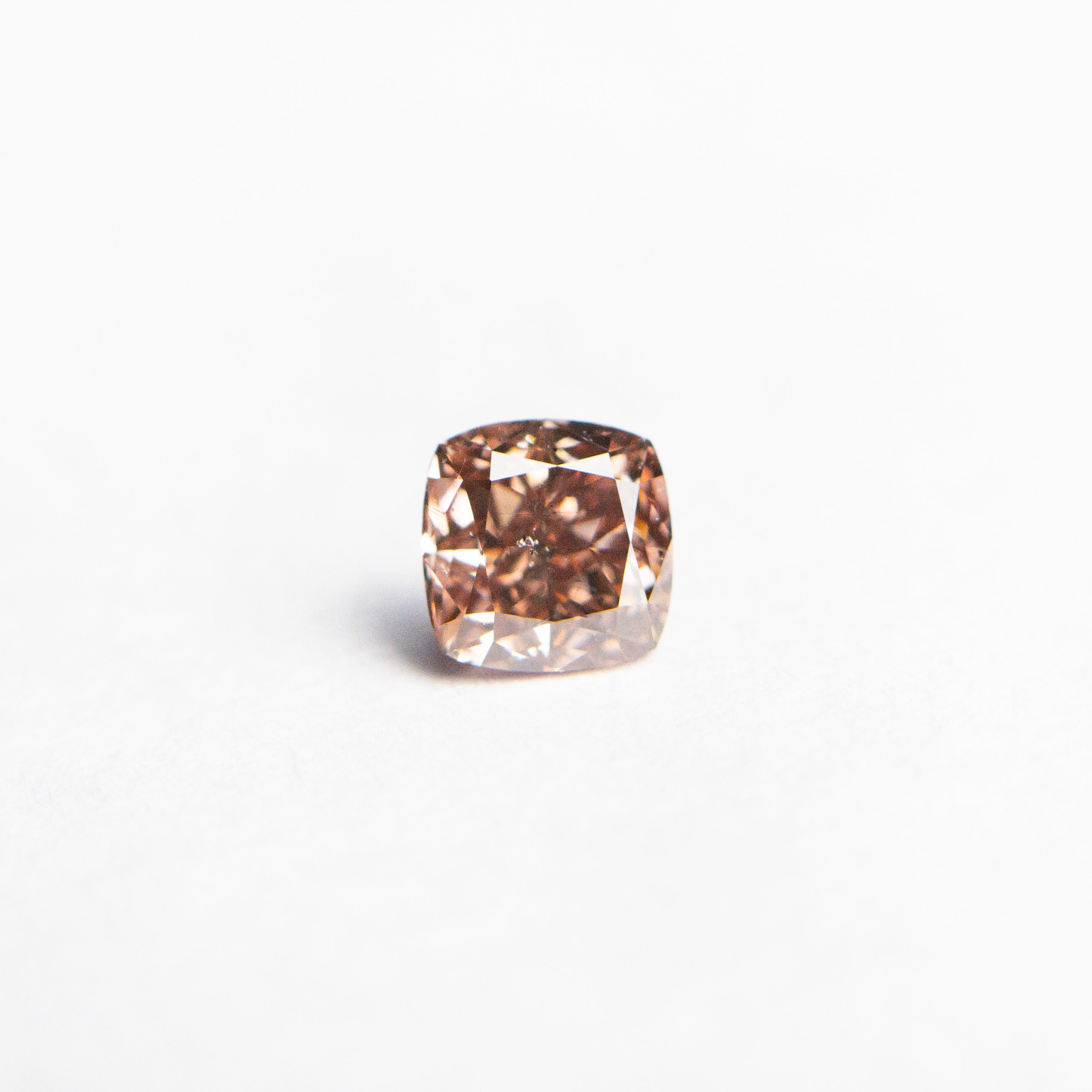 The 0.30ct 3.74x3.69x2.49mm GIA SI2 Fancy Deep Brownish Orangy Pink Cushion Brilliant 🇦🇺 24104-01 by East London jeweller Rachel Boston | Discover our collections of unique and timeless engagement rings, wedding rings, and modern fine jewellery.