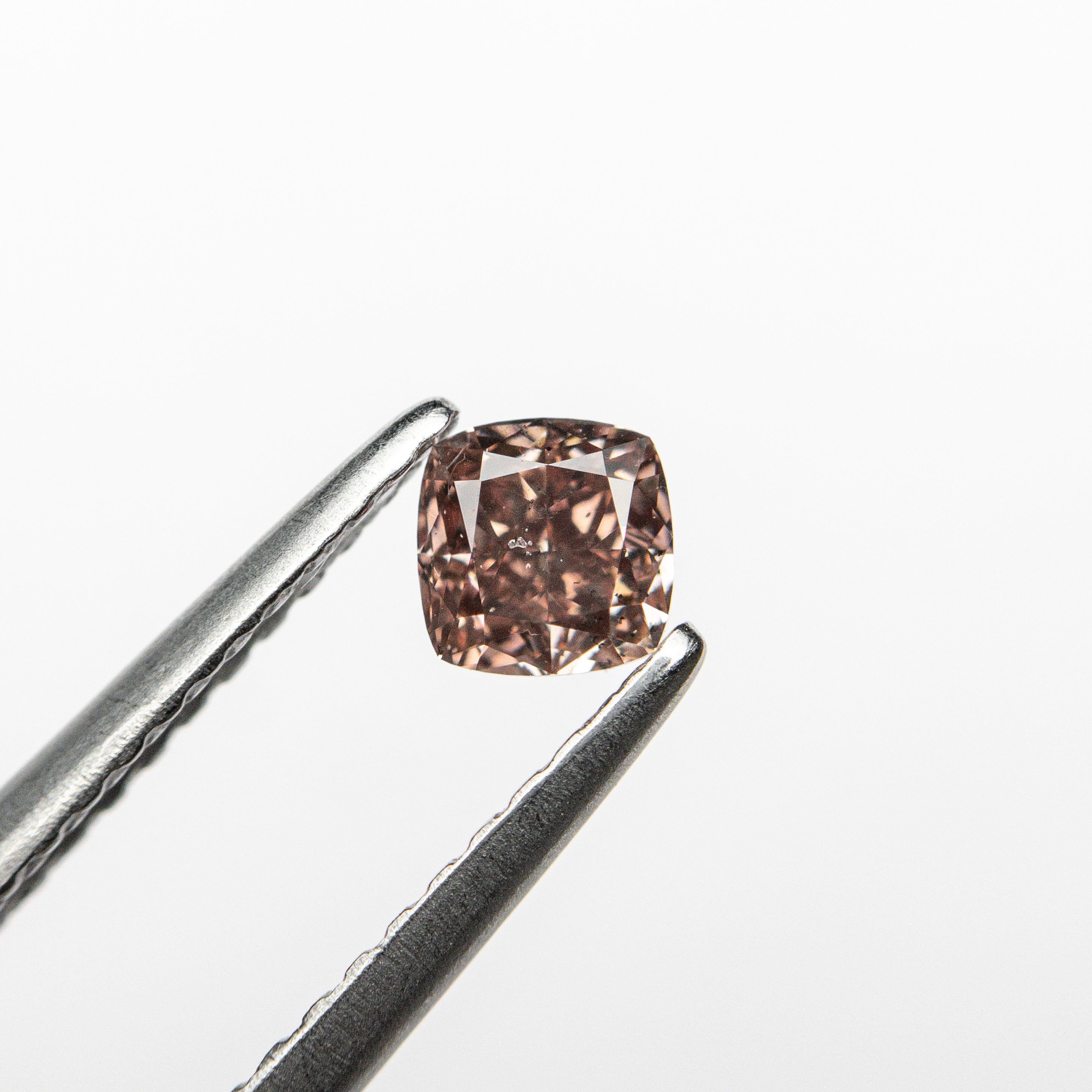 The 0.30ct 3.74x3.69x2.49mm GIA SI2 Fancy Deep Brownish Orangy Pink Cushion Brilliant 🇦🇺 24104-01 by East London jeweller Rachel Boston | Discover our collections of unique and timeless engagement rings, wedding rings, and modern fine jewellery.