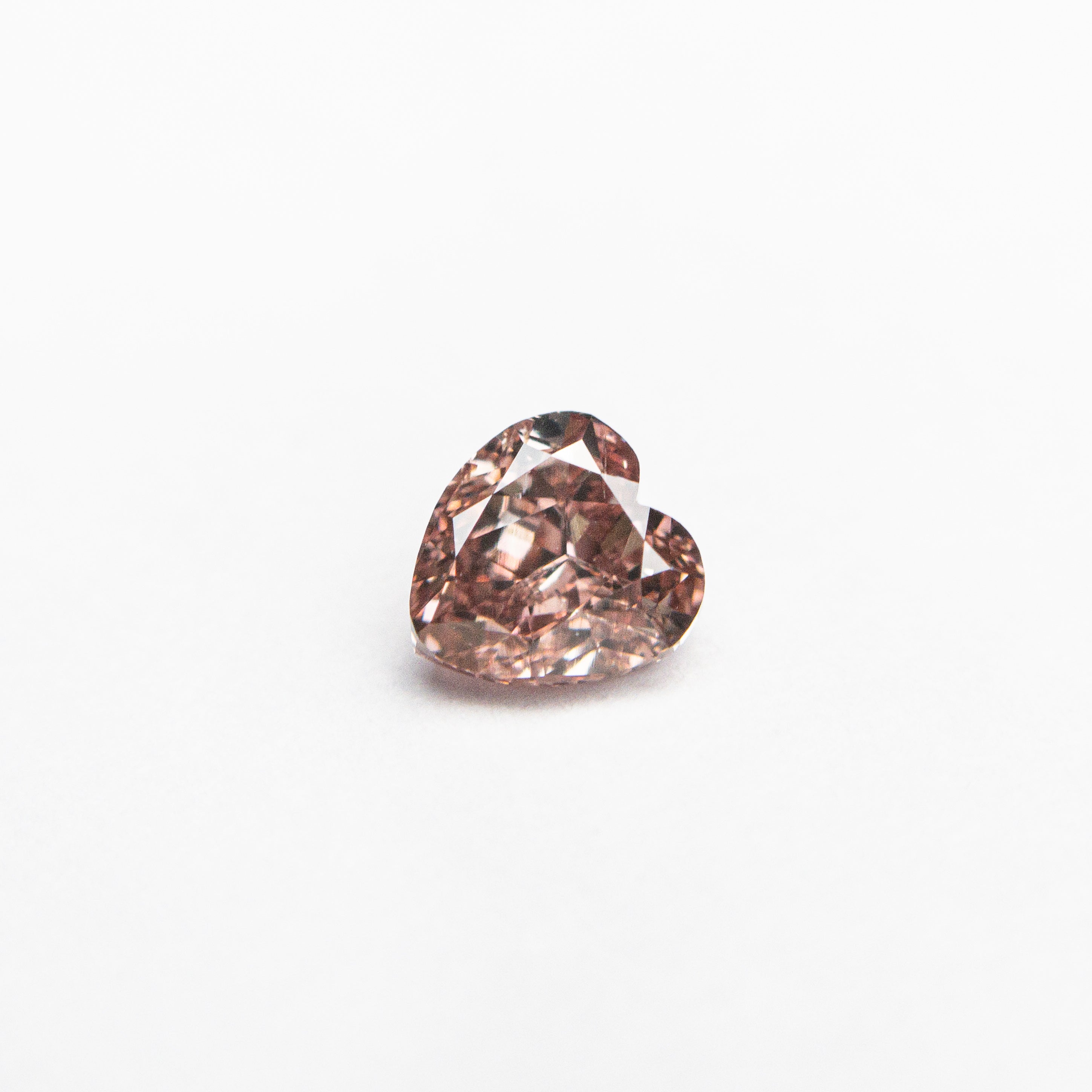 The 0.30ct 4.16x3.94x2.43mm GIA SI2 Fancy Deep Orangy Pink Heart Brilliant 🇦🇺 24122-01 by East London jeweller Rachel Boston | Discover our collections of unique and timeless engagement rings, wedding rings, and modern fine jewellery.