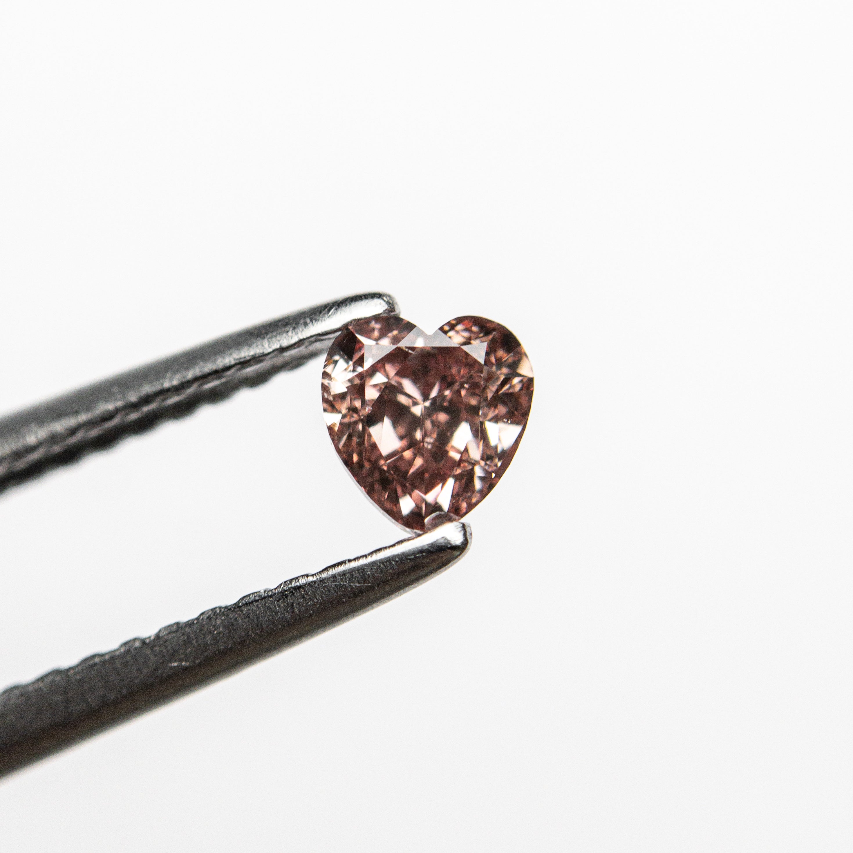 The 0.30ct 4.16x3.94x2.43mm GIA SI2 Fancy Deep Orangy Pink Heart Brilliant 🇦🇺 24122-01 by East London jeweller Rachel Boston | Discover our collections of unique and timeless engagement rings, wedding rings, and modern fine jewellery.