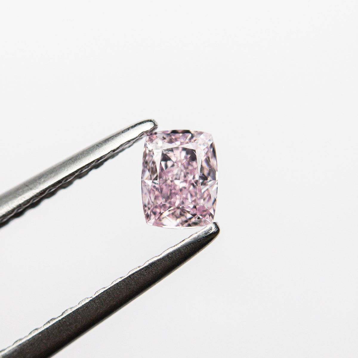 The 0.30ct 4.43x3.39x2.27mm GIA SI2 Fancy Intense Purple-Pink Cushion Brilliant 🇨🇦 24164-01 by East London jeweller Rachel Boston | Discover our collections of unique and timeless engagement rings, wedding rings, and modern fine jewellery.