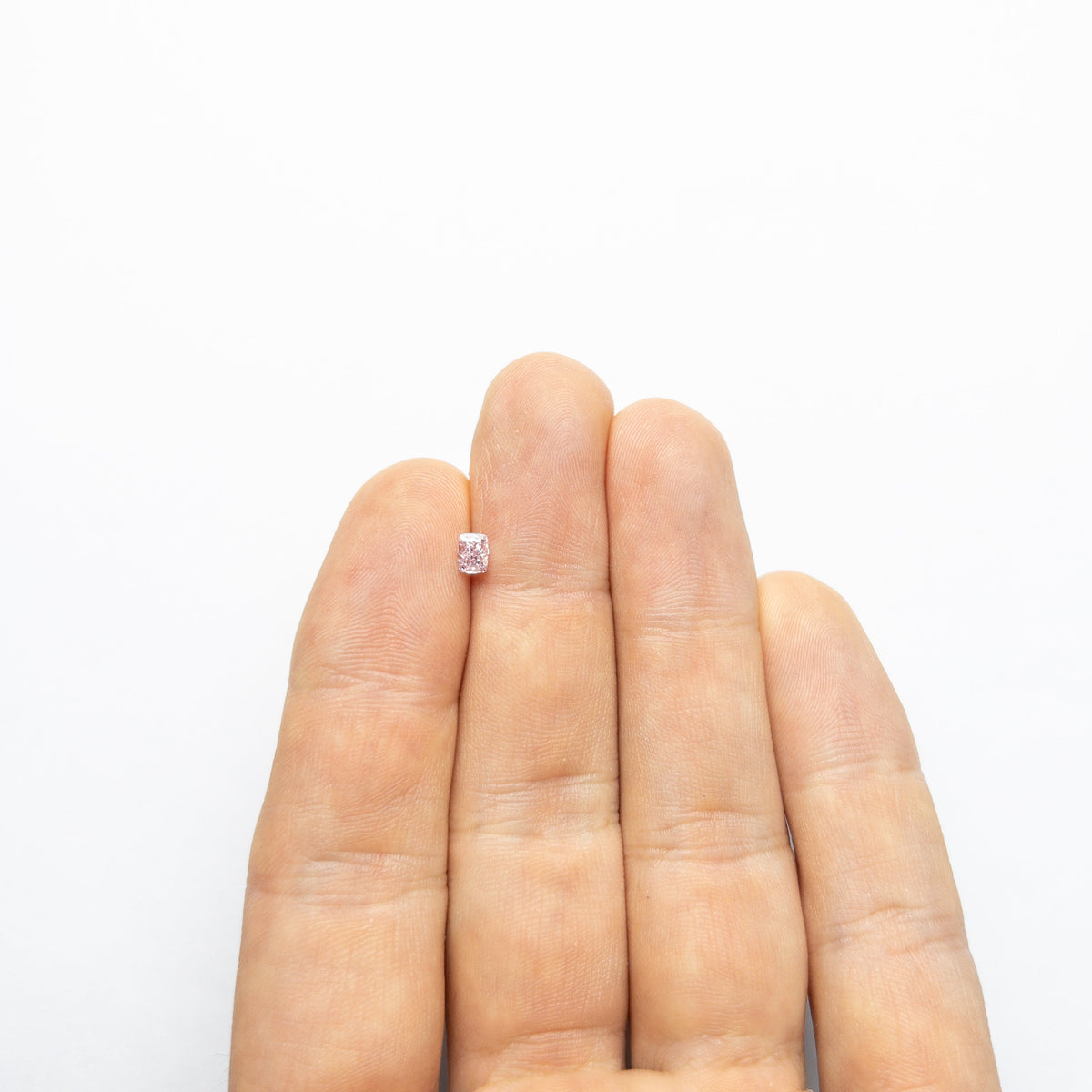 The 0.30ct 4.43x3.39x2.27mm GIA SI2 Fancy Intense Purple-Pink Cushion Brilliant 🇨🇦 24164-01 by East London jeweller Rachel Boston | Discover our collections of unique and timeless engagement rings, wedding rings, and modern fine jewellery.