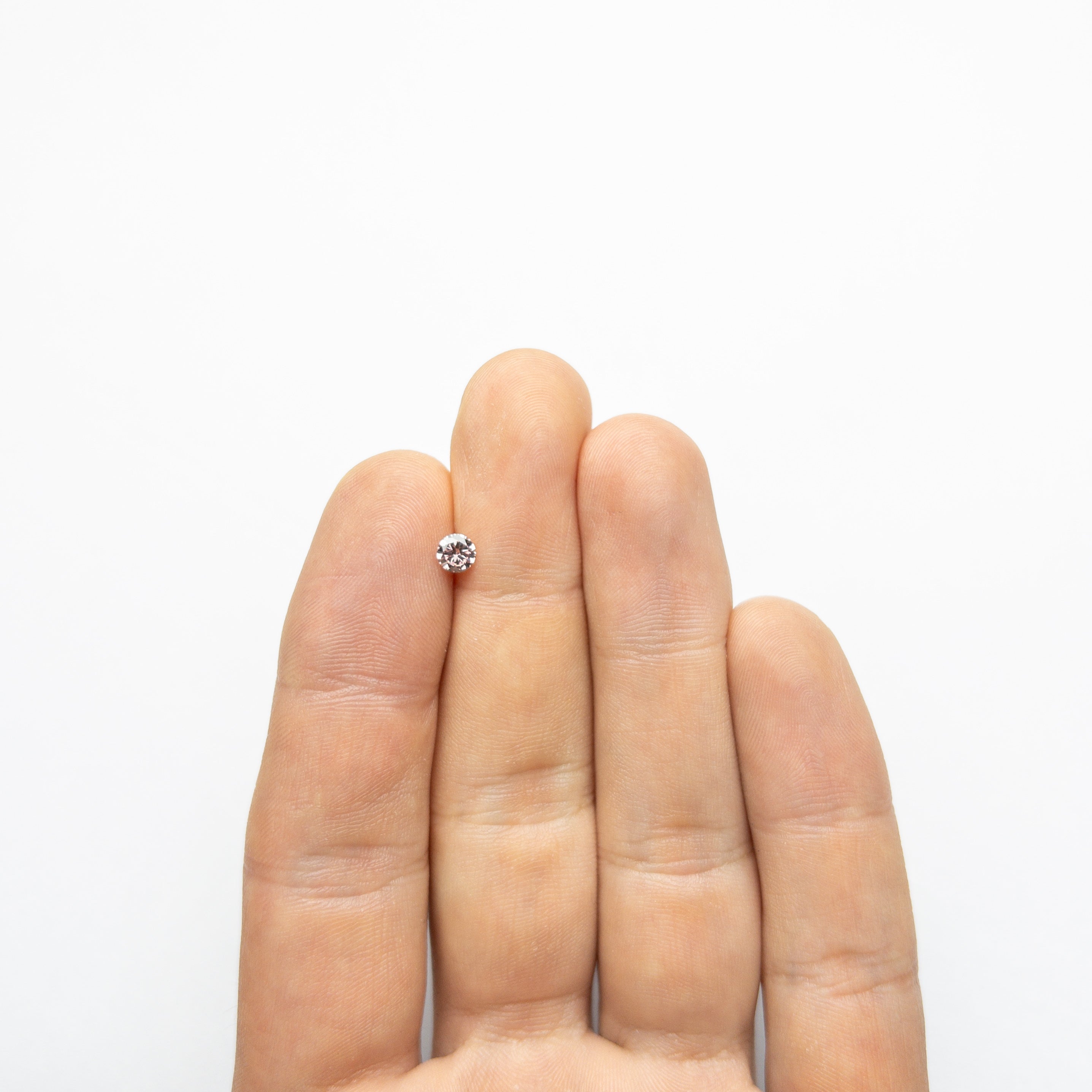 The 0.30ct 4.43x4.41x2.45mm GIA SI2 Fancy Intense Pink Round Brilliant 24144-01 by East London jeweller Rachel Boston | Discover our collections of unique and timeless engagement rings, wedding rings, and modern fine jewellery.