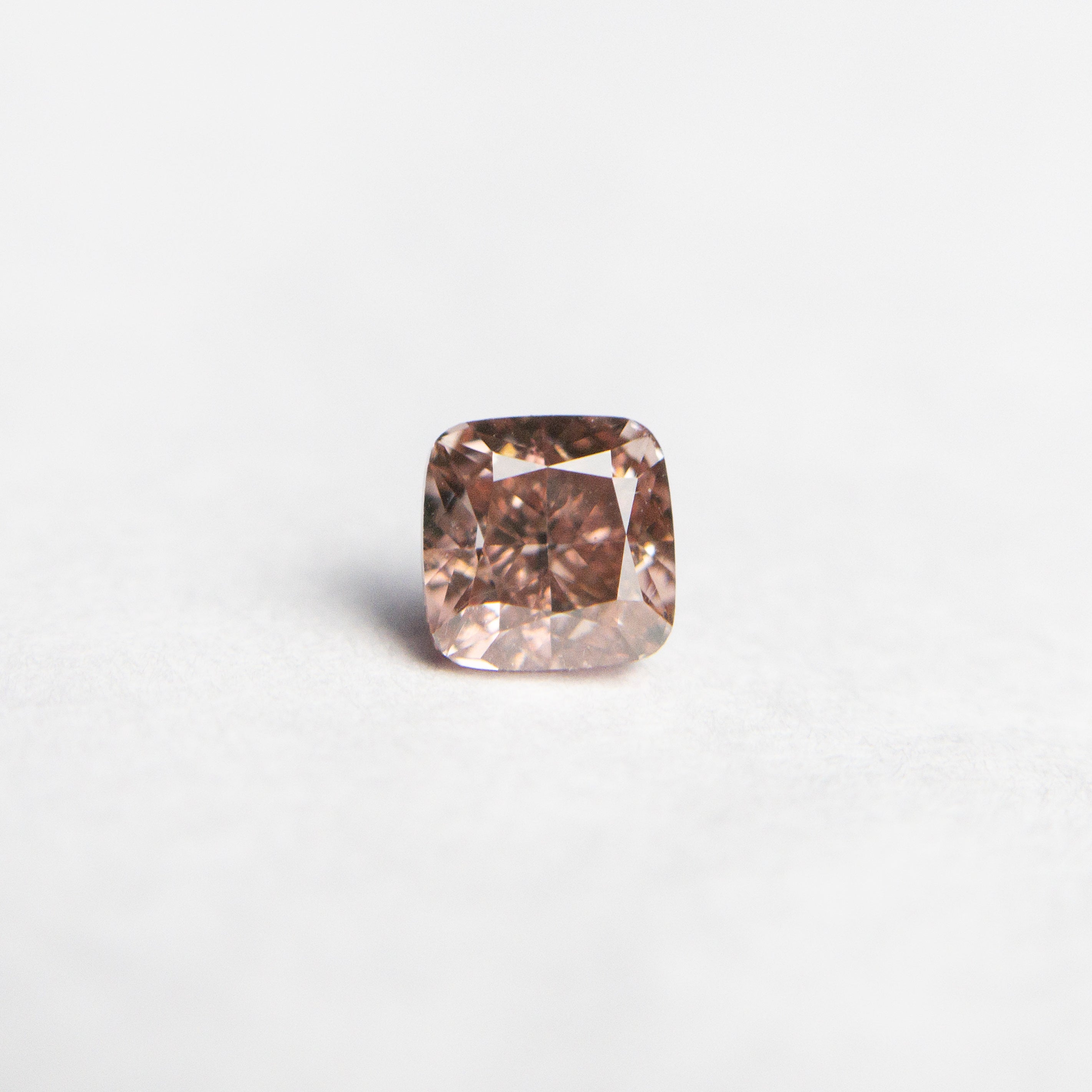 The 0.31ct 3.57x3.54x2.57mm GIA SI1 Fancy Deep Brownish Orangy Pink Cushion Brilliant 🇦🇺 24105-01 by East London jeweller Rachel Boston | Discover our collections of unique and timeless engagement rings, wedding rings, and modern fine jewellery.