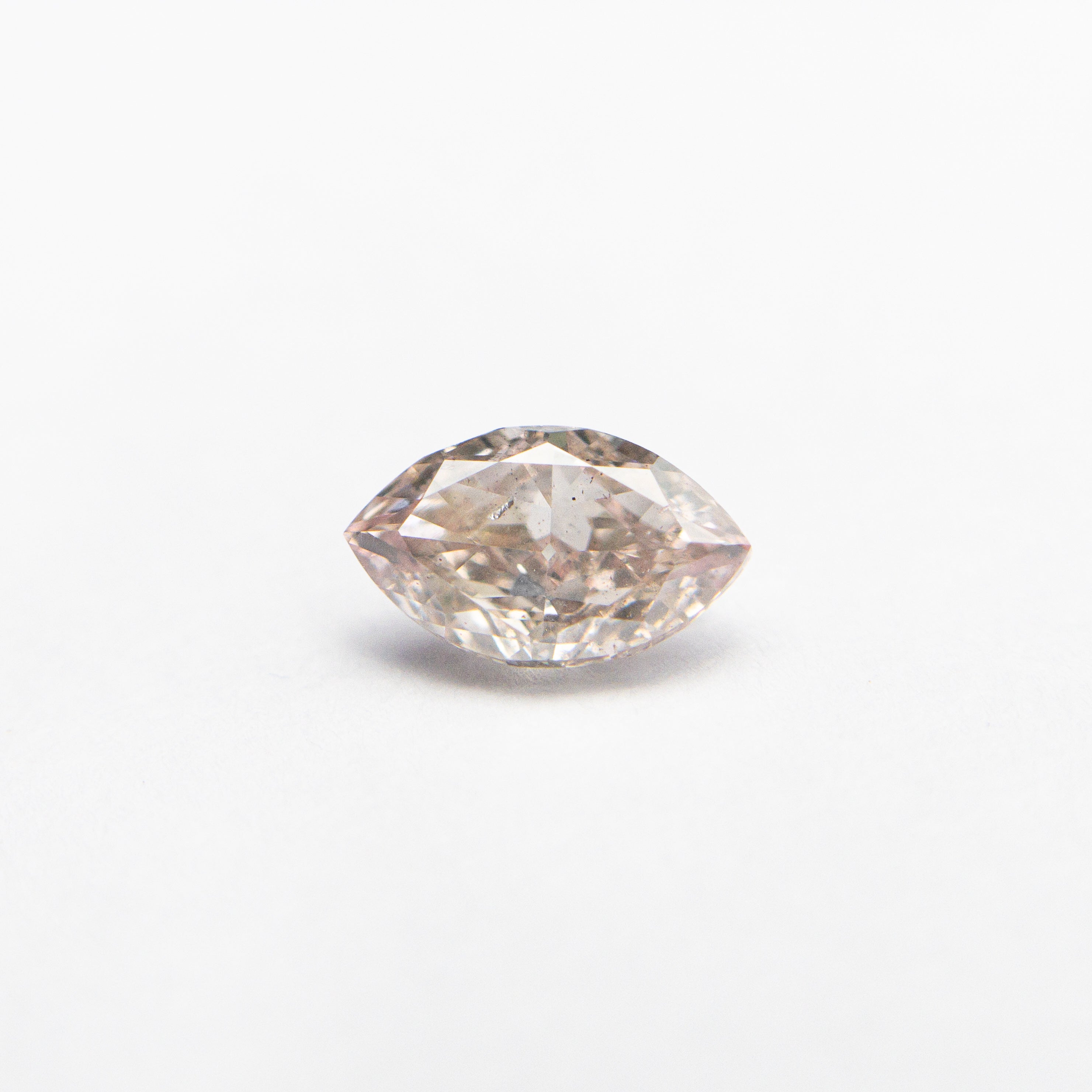 The 0.32ct 5.87x3.48x2.06mm SI1 Fancy Pink Marquise Brilliant 24107-01 by East London jeweller Rachel Boston | Discover our collections of unique and timeless engagement rings, wedding rings, and modern fine jewellery.