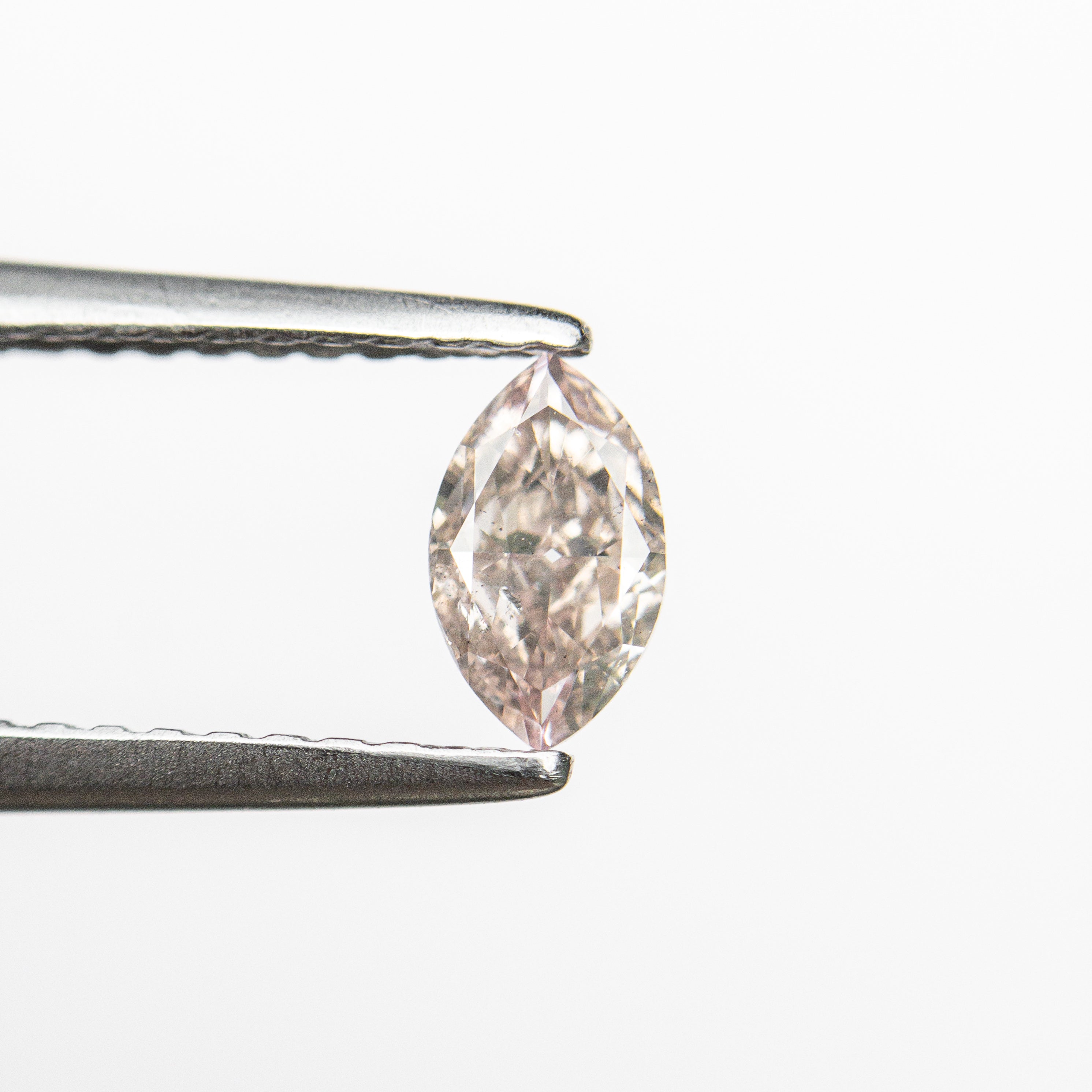 The 0.32ct 5.87x3.48x2.06mm SI1 Fancy Pink Marquise Brilliant 24107-01 by East London jeweller Rachel Boston | Discover our collections of unique and timeless engagement rings, wedding rings, and modern fine jewellery.