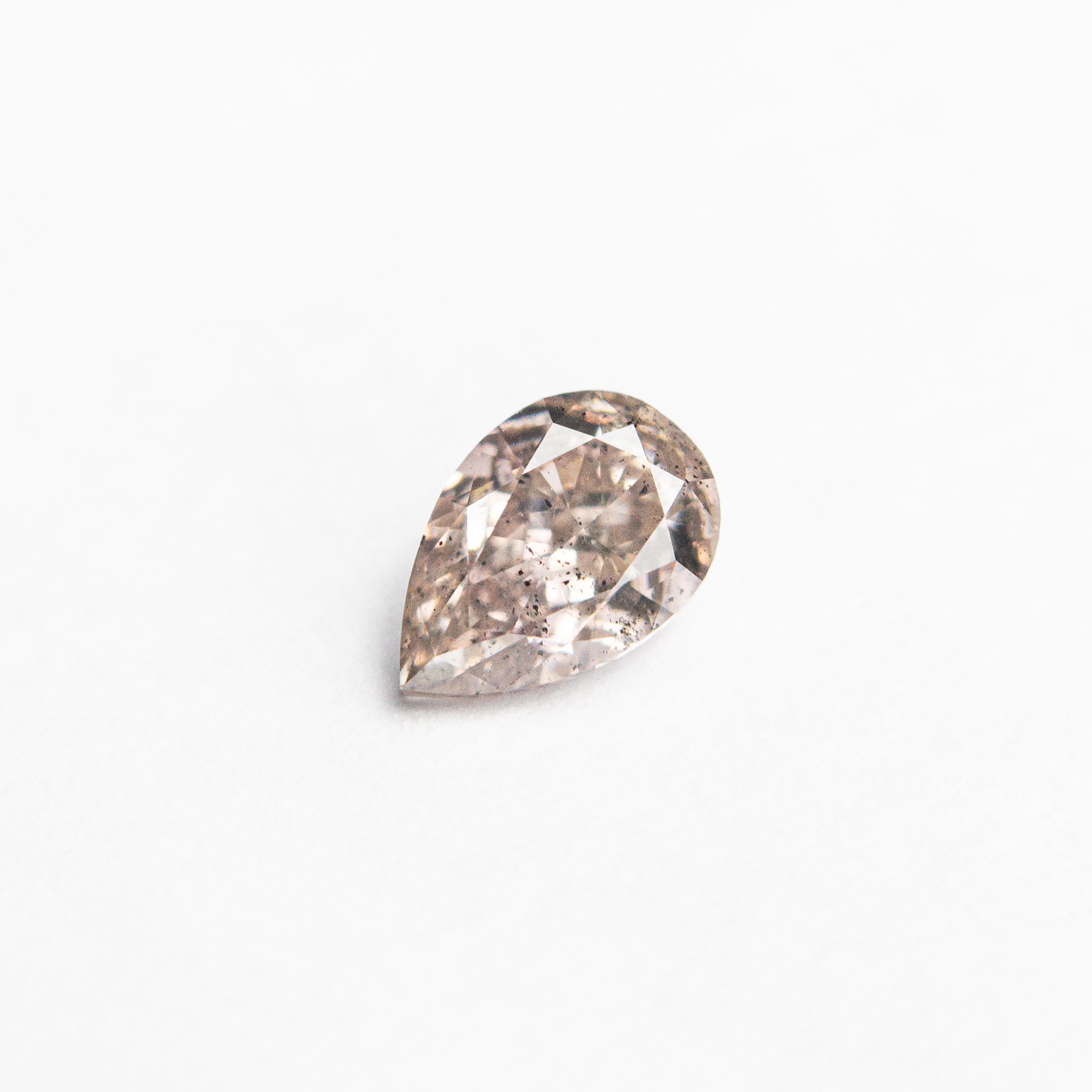 The 0.34ct 5.35x3.56x2.35mm I1 Fancy Pink-Brown Pear Brilliant 24119-01 by East London jeweller Rachel Boston | Discover our collections of unique and timeless engagement rings, wedding rings, and modern fine jewellery.