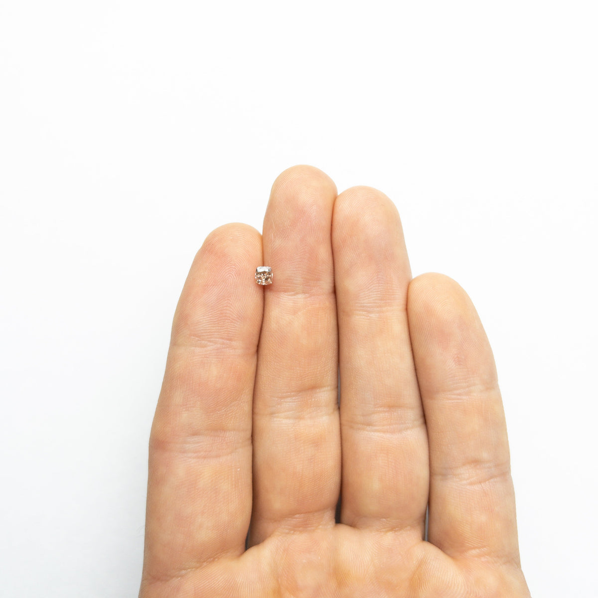 The 0.35ct 3.92x3.71x2.65mm GIA VS2 Fancy Brown-Pink Cushion Brilliant 🇦🇺 24124-01 by East London jeweller Rachel Boston | Discover our collections of unique and timeless engagement rings, wedding rings, and modern fine jewellery.