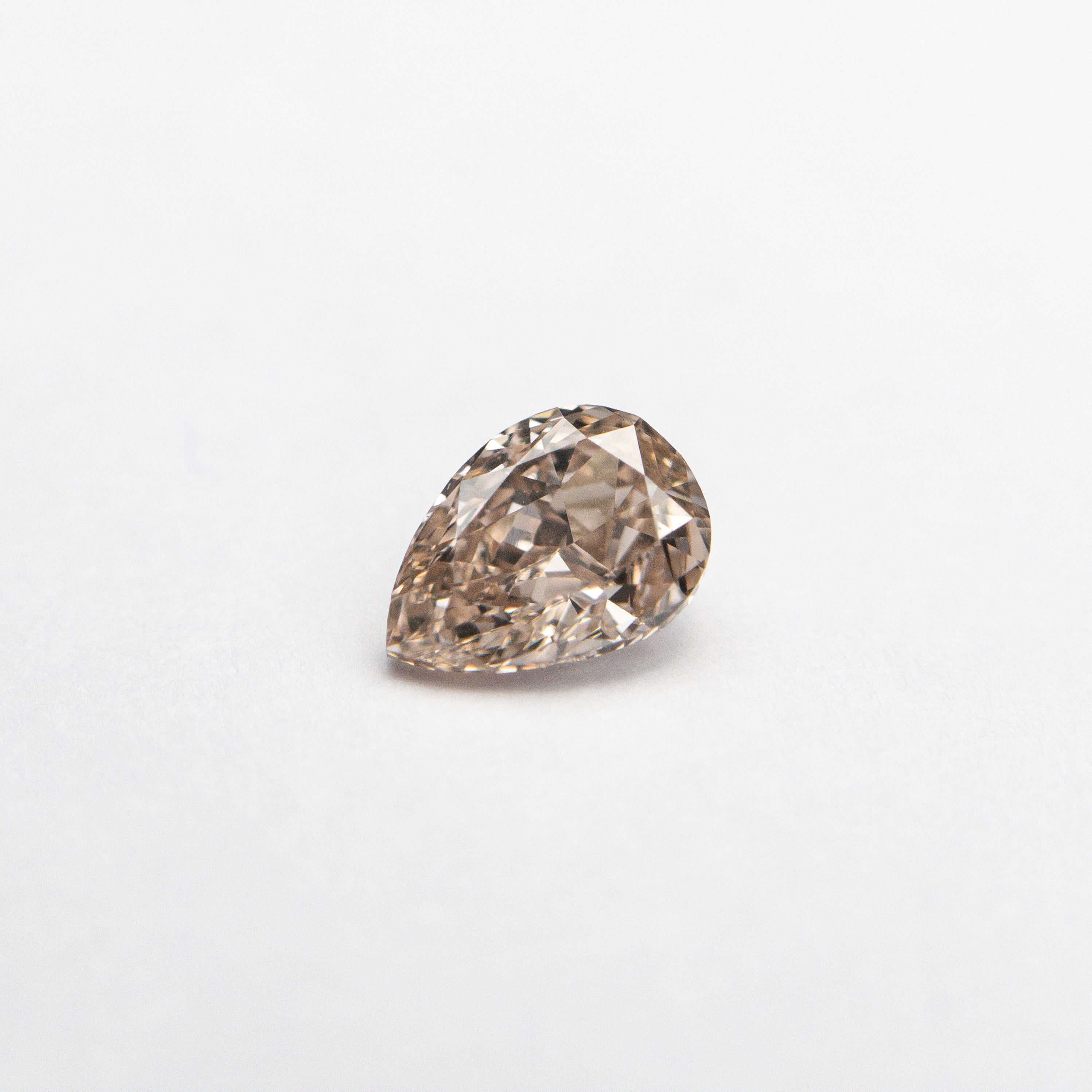 The 0.35ct 5.24x3.75x2.45mm GIA VS2 Fancy Brown-Pink Pear Brilliant 🇦🇺 24093-01 by East London jeweller Rachel Boston | Discover our collections of unique and timeless engagement rings, wedding rings, and modern fine jewellery.