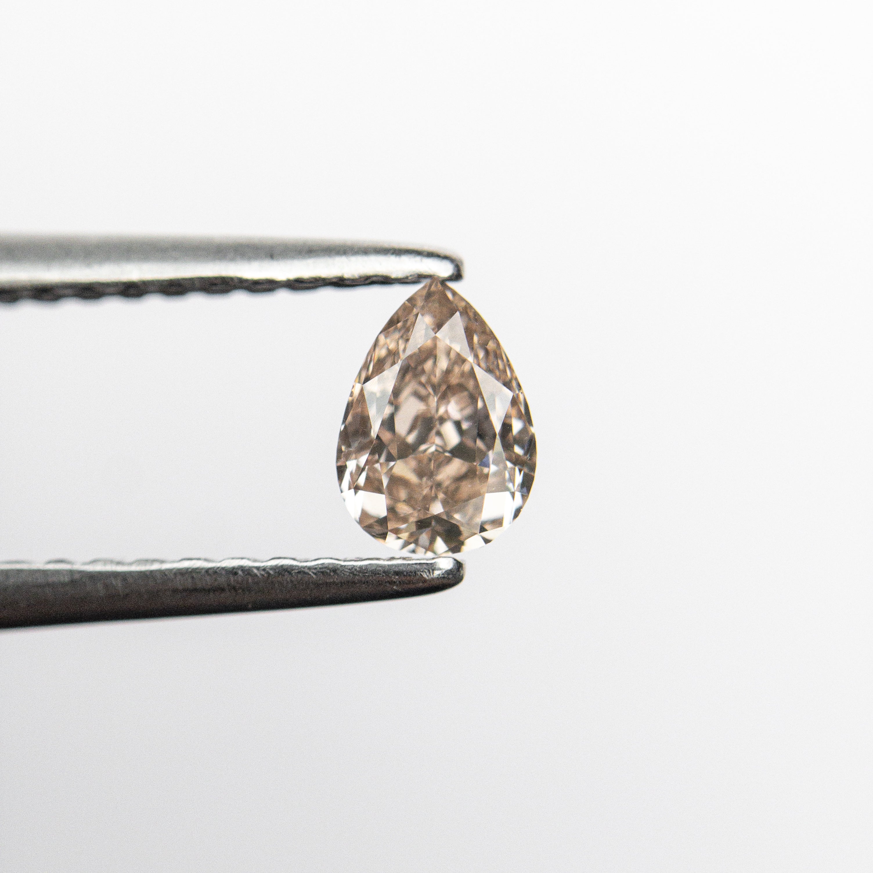 The 0.35ct 5.24x3.75x2.45mm GIA VS2 Fancy Brown-Pink Pear Brilliant 🇦🇺 24093-01 by East London jeweller Rachel Boston | Discover our collections of unique and timeless engagement rings, wedding rings, and modern fine jewellery.