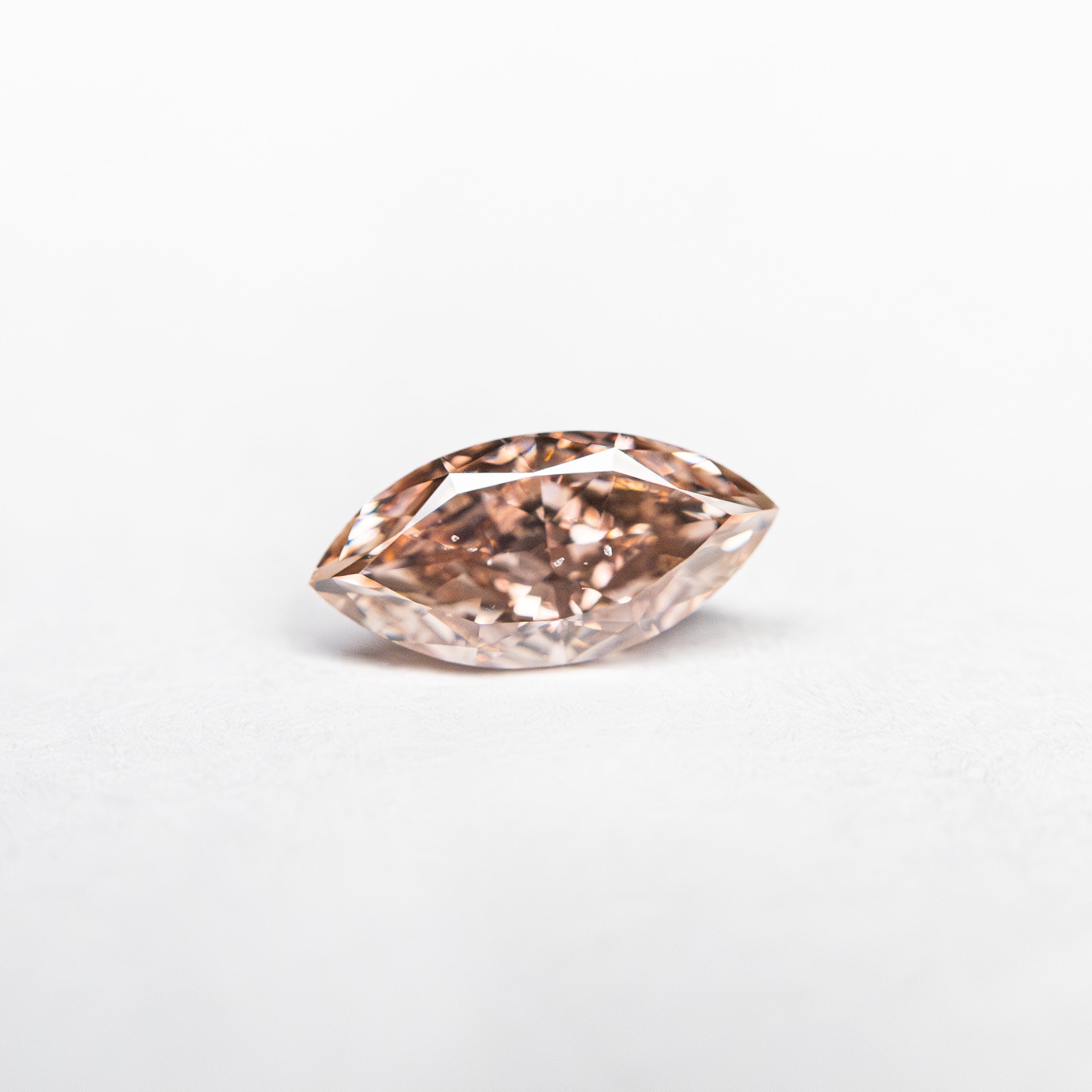 The 0.35ct 6.93x3.37x2.17mm SI1 Fancy Intense Orangy Pink Marquise Brilliant 🇦🇺 24149-01 by East London jeweller Rachel Boston | Discover our collections of unique and timeless engagement rings, wedding rings, and modern fine jewellery.