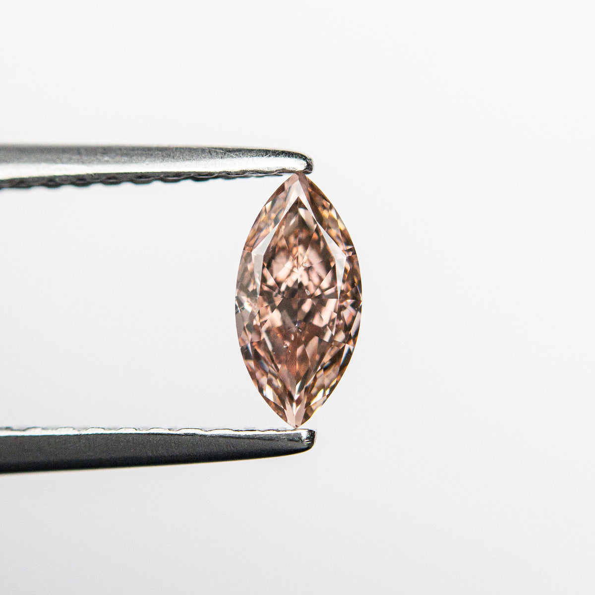 The 0.35ct 6.93x3.37x2.17mm SI1 Fancy Intense Orangy Pink Marquise Brilliant 🇦🇺 24149-01 by East London jeweller Rachel Boston | Discover our collections of unique and timeless engagement rings, wedding rings, and modern fine jewellery.