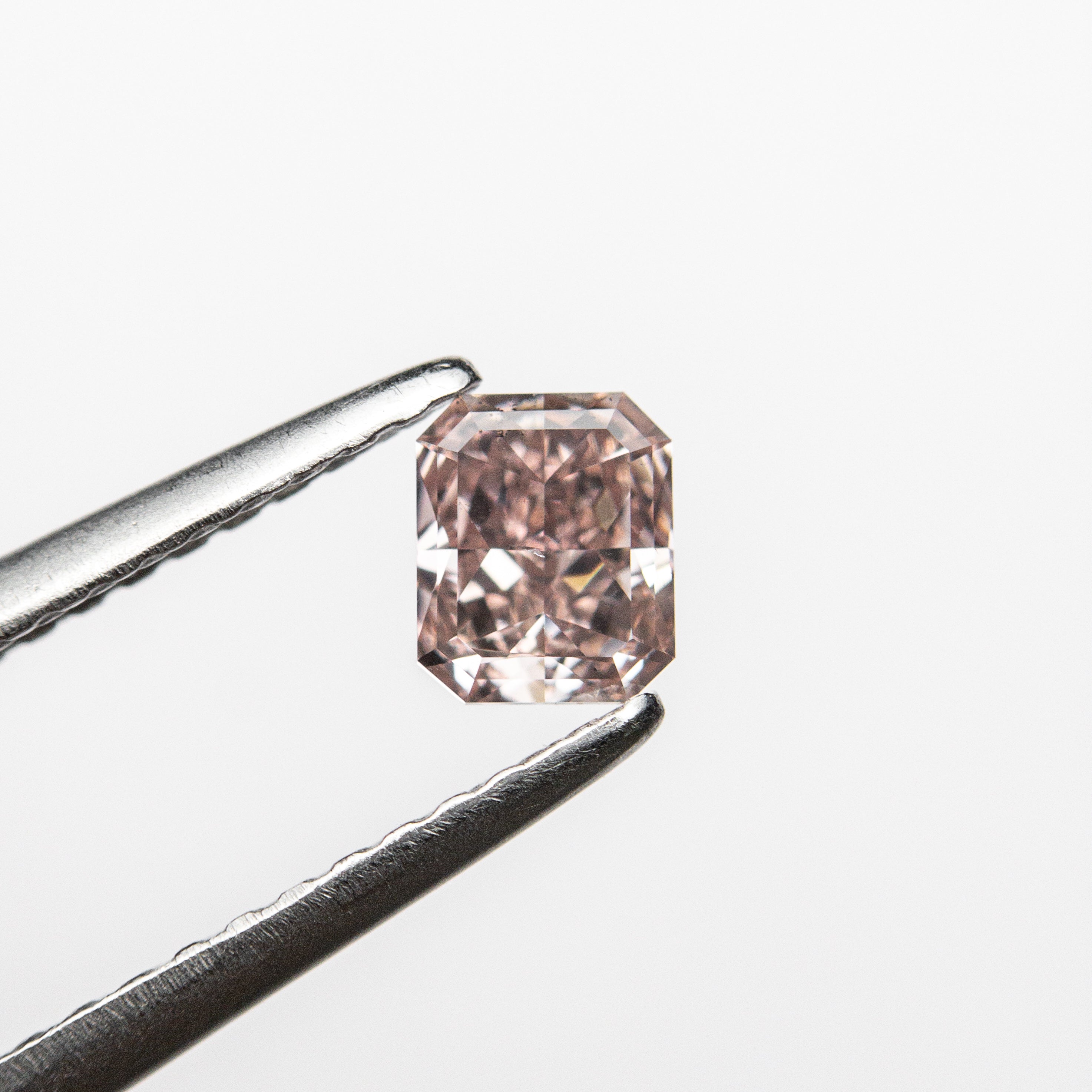 The 0.36ct 4.46x3.68x2.31mm GIA SI1 Fancy Orangy Pink Cut Corner Rectangle Brilliant 🇦🇺 24123-01 by East London jeweller Rachel Boston | Discover our collections of unique and timeless engagement rings, wedding rings, and modern fine jewellery.