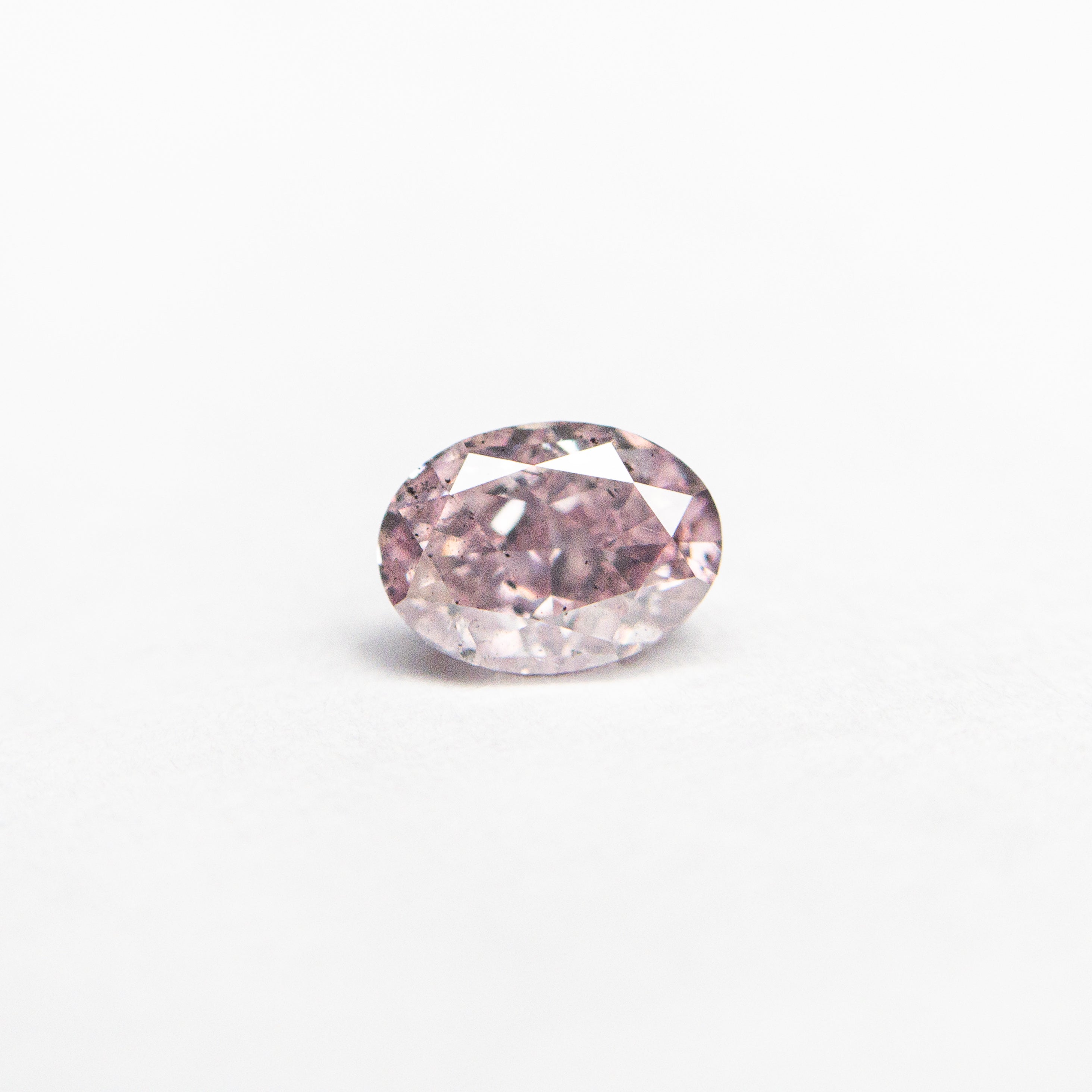 The 0.40ct 4.98x3.64x2.68mm GIA I1 Fancy Intense Purple-Pink Oval Brilliant 🇦🇺 24120-01 by East London jeweller Rachel Boston | Discover our collections of unique and timeless engagement rings, wedding rings, and modern fine jewellery.