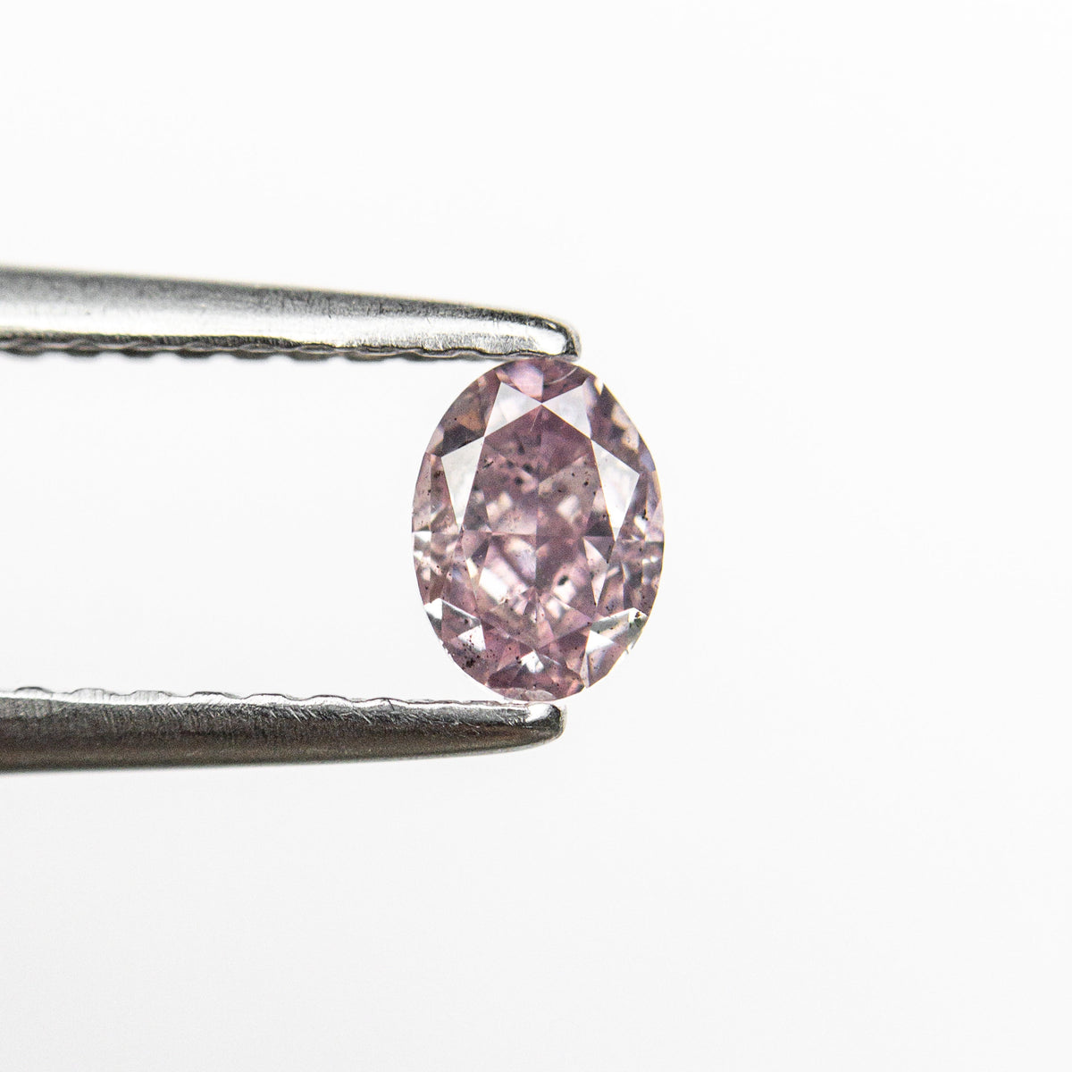 The 0.40ct 4.98x3.64x2.68mm GIA I1 Fancy Intense Purple-Pink Oval Brilliant 🇦🇺 24120-01 by East London jeweller Rachel Boston | Discover our collections of unique and timeless engagement rings, wedding rings, and modern fine jewellery.