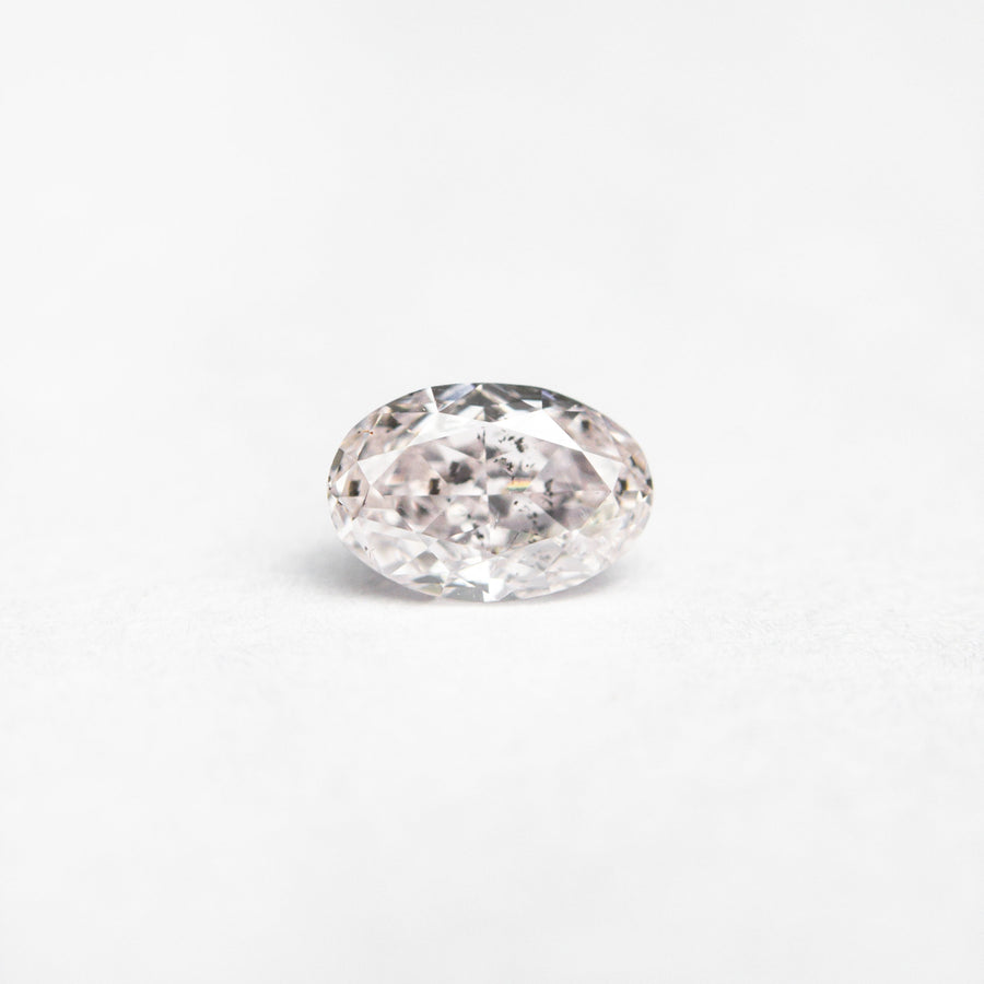 The 0.40ct 5.38x3.60x2.59mm GIA I1 Fancy Light Pink Oval Brilliant 24094-01 by East London jeweller Rachel Boston | Discover our collections of unique and timeless engagement rings, wedding rings, and modern fine jewellery. - Rachel Boston Jewellery