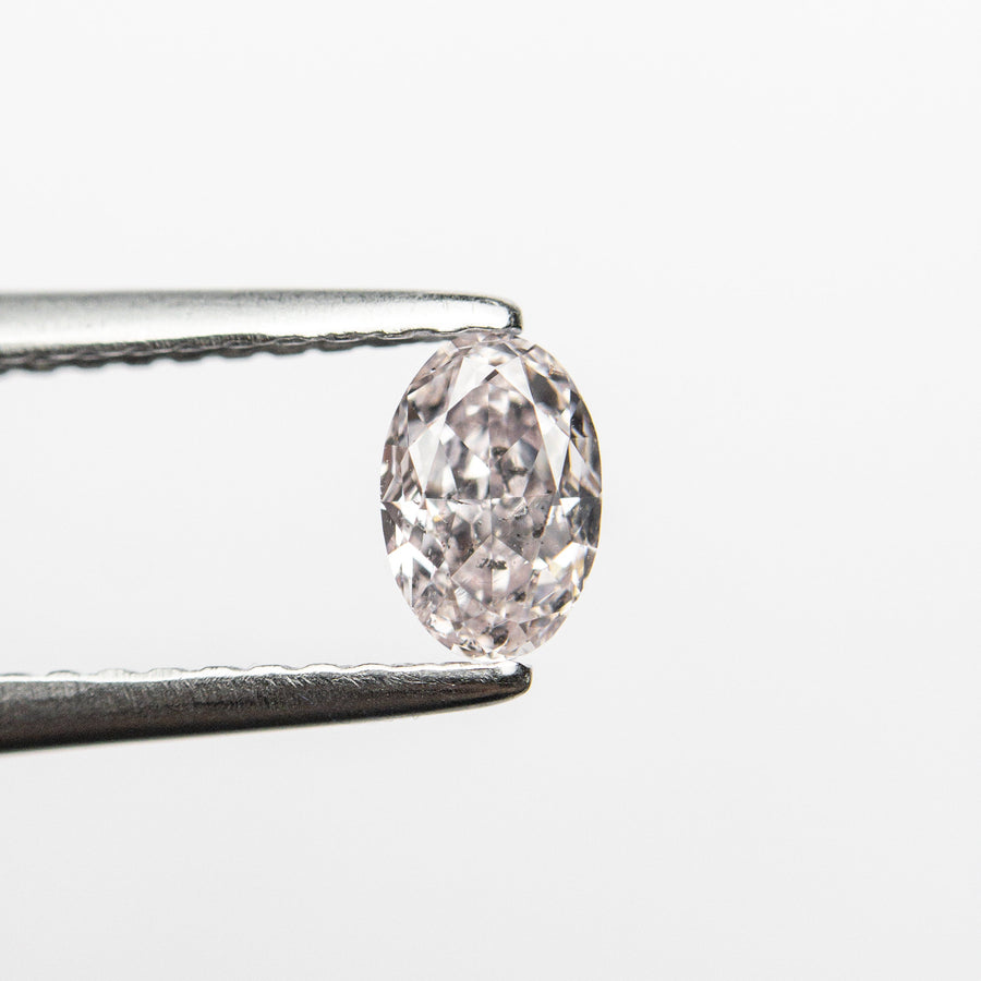 The 0.40ct 5.38x3.60x2.59mm GIA I1 Fancy Light Pink Oval Brilliant 24094-01 by East London jeweller Rachel Boston | Discover our collections of unique and timeless engagement rings, wedding rings, and modern fine jewellery. - Rachel Boston Jewellery