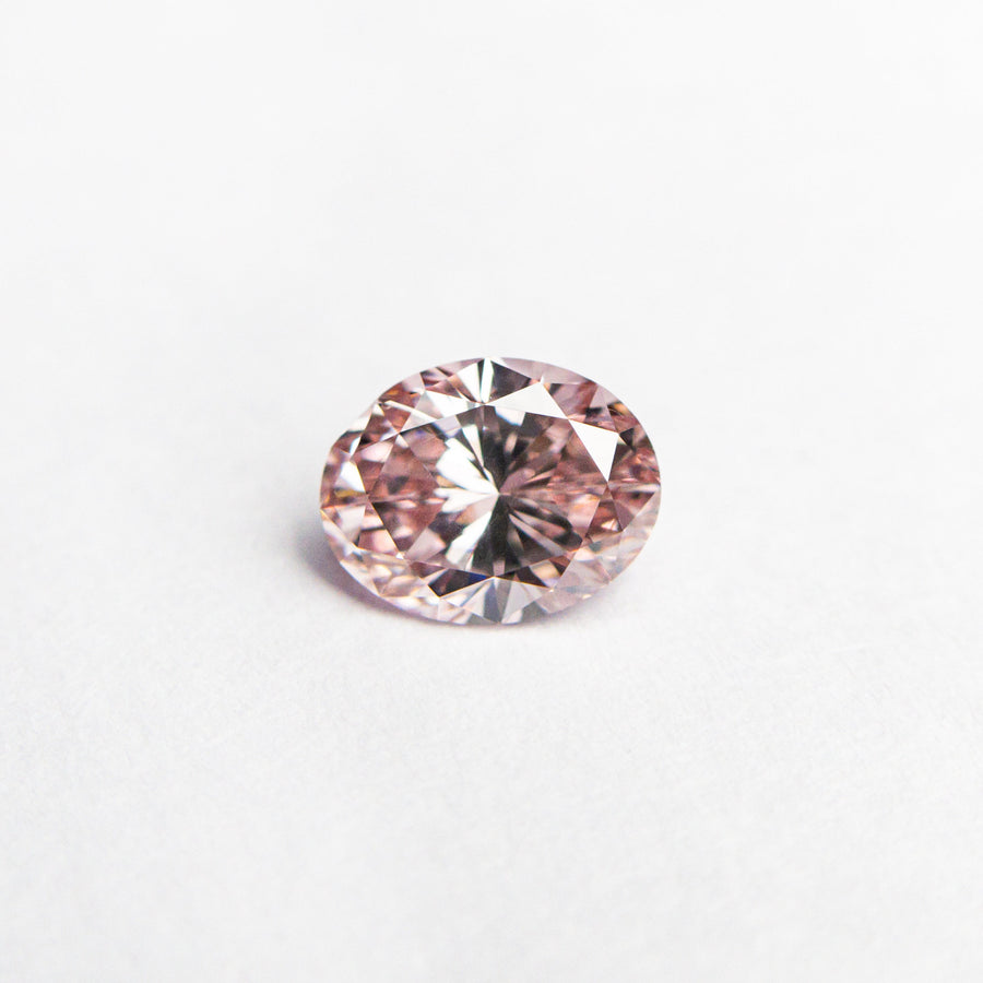 The 0.40ct 5.42x4.21x2.69mm GIA VS2 Fancy Intense Pink Oval Brilliant 24157-01 by East London jeweller Rachel Boston | Discover our collections of unique and timeless engagement rings, wedding rings, and modern fine jewellery. - Rachel Boston Jewellery