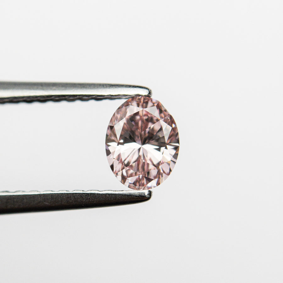 The 0.40ct 5.42x4.21x2.69mm GIA VS2 Fancy Intense Pink Oval Brilliant 24157-01 by East London jeweller Rachel Boston | Discover our collections of unique and timeless engagement rings, wedding rings, and modern fine jewellery. - Rachel Boston Jewellery