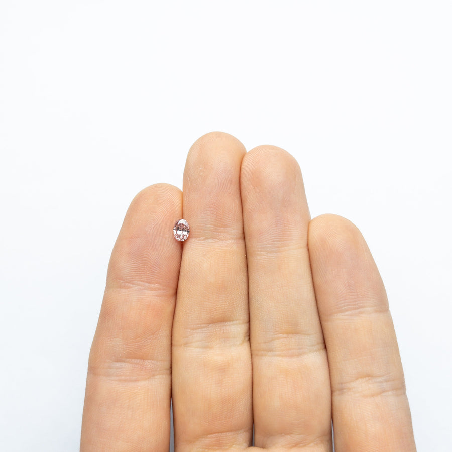The 0.40ct 5.42x4.21x2.69mm GIA VS2 Fancy Intense Pink Oval Brilliant 24157-01 by East London jeweller Rachel Boston | Discover our collections of unique and timeless engagement rings, wedding rings, and modern fine jewellery. - Rachel Boston Jewellery