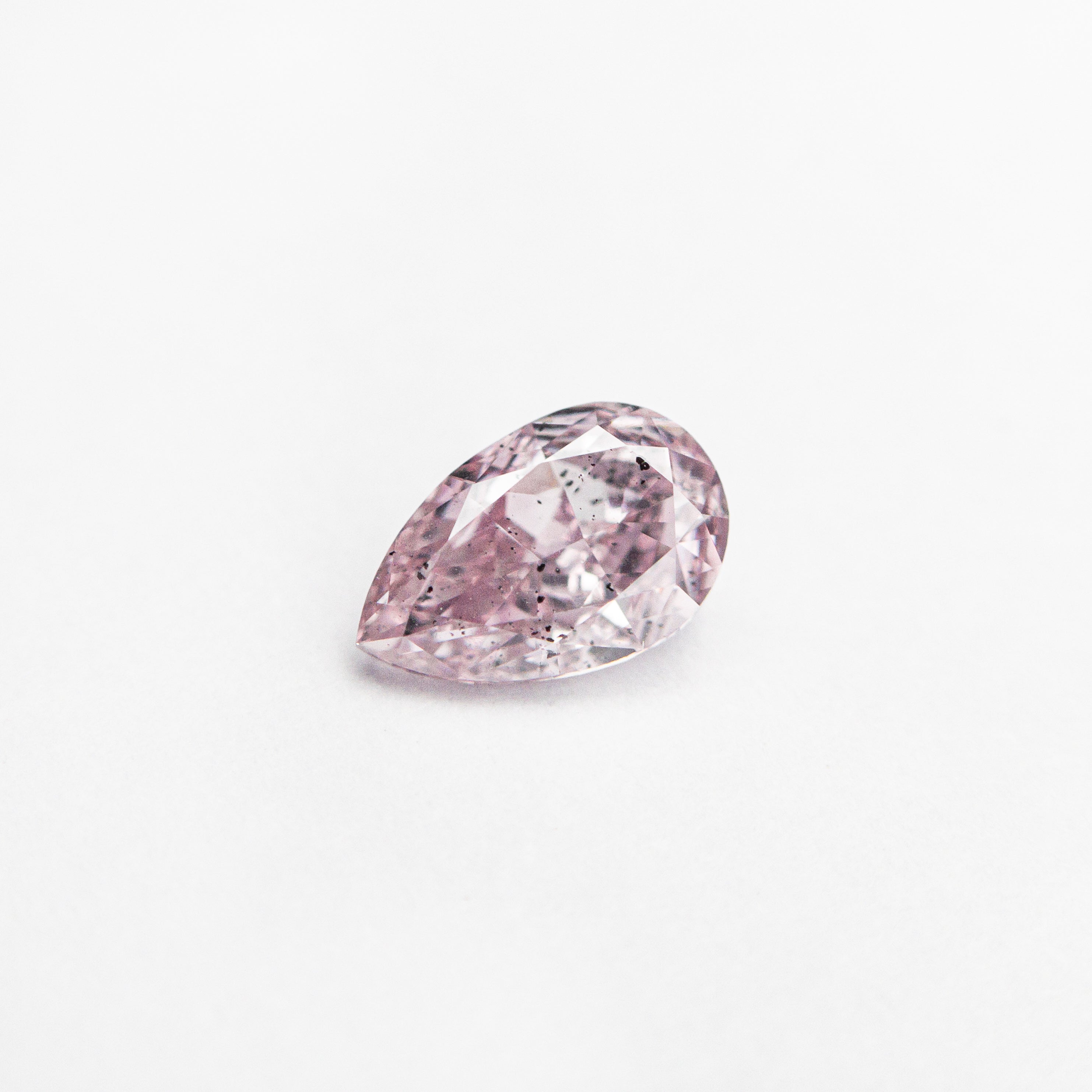 The 0.40ct 5.93x3.77x2.41mm GIA SI2 Fancy Purplish Pink Pear Brilliant 🇦🇺 24127-01 by East London jeweller Rachel Boston | Discover our collections of unique and timeless engagement rings, wedding rings, and modern fine jewellery.