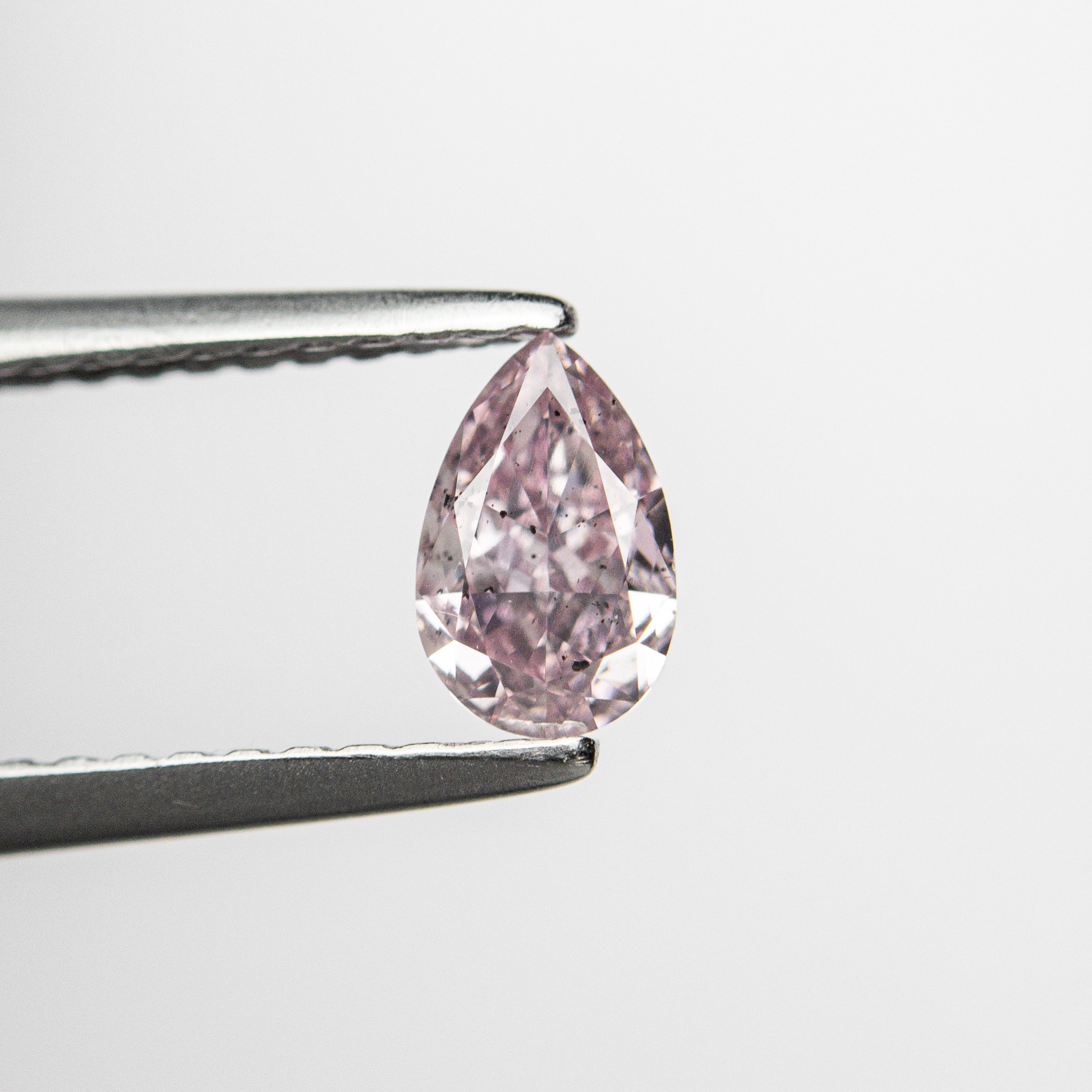 The 0.40ct 5.93x3.77x2.41mm GIA SI2 Fancy Purplish Pink Pear Brilliant 🇦🇺 24127-01 by East London jeweller Rachel Boston | Discover our collections of unique and timeless engagement rings, wedding rings, and modern fine jewellery.