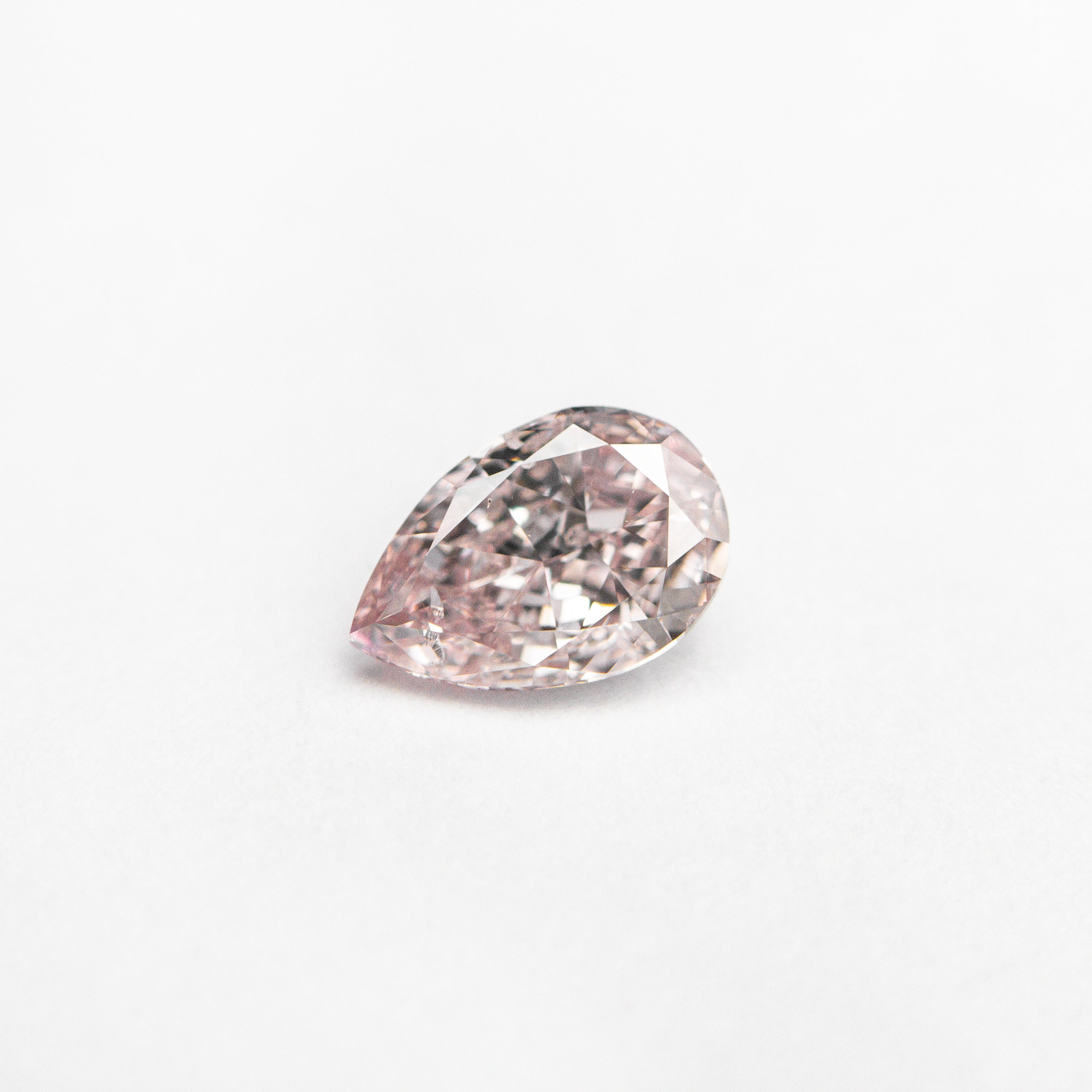 The 0.40ct 6.02x4.05x2.37mm GIA I1 Fancy Pink Pear Brilliant 🇦🇺 24128-01 by East London jeweller Rachel Boston | Discover our collections of unique and timeless engagement rings, wedding rings, and modern fine jewellery.