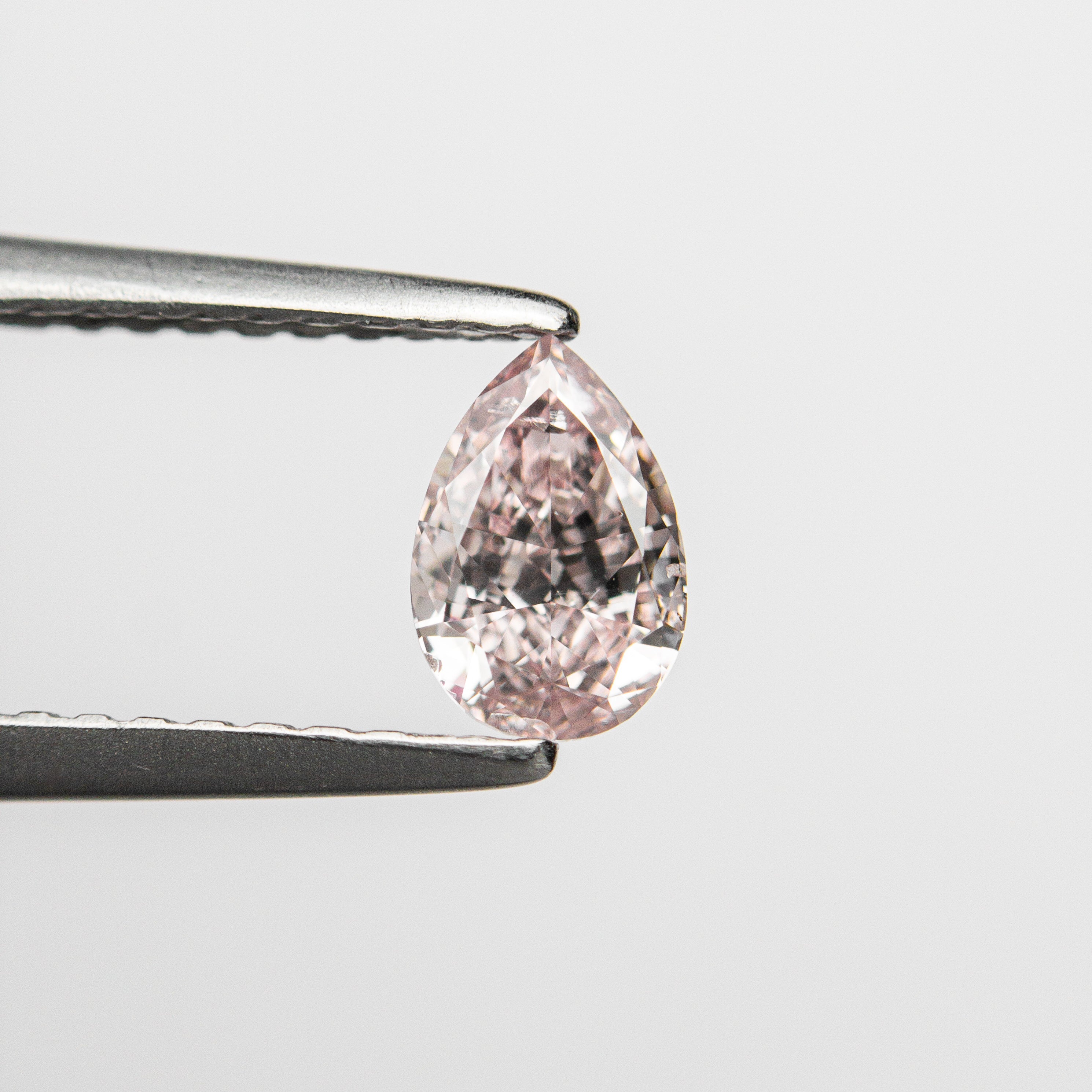 The 0.40ct 6.02x4.05x2.37mm GIA I1 Fancy Pink Pear Brilliant 🇦🇺 24128-01 by East London jeweller Rachel Boston | Discover our collections of unique and timeless engagement rings, wedding rings, and modern fine jewellery.