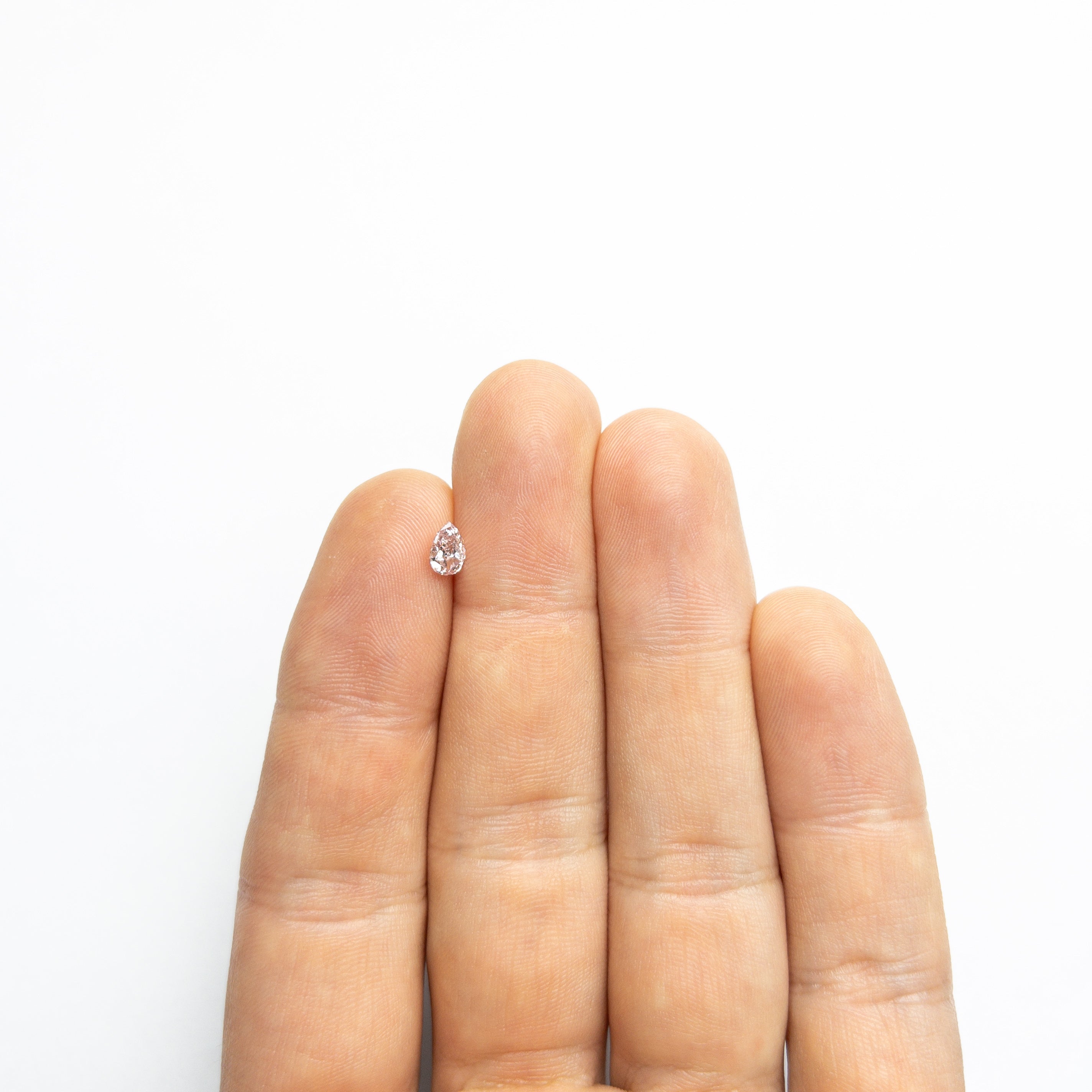 The 0.40ct 6.02x4.05x2.37mm GIA I1 Fancy Pink Pear Brilliant 🇦🇺 24128-01 by East London jeweller Rachel Boston | Discover our collections of unique and timeless engagement rings, wedding rings, and modern fine jewellery.