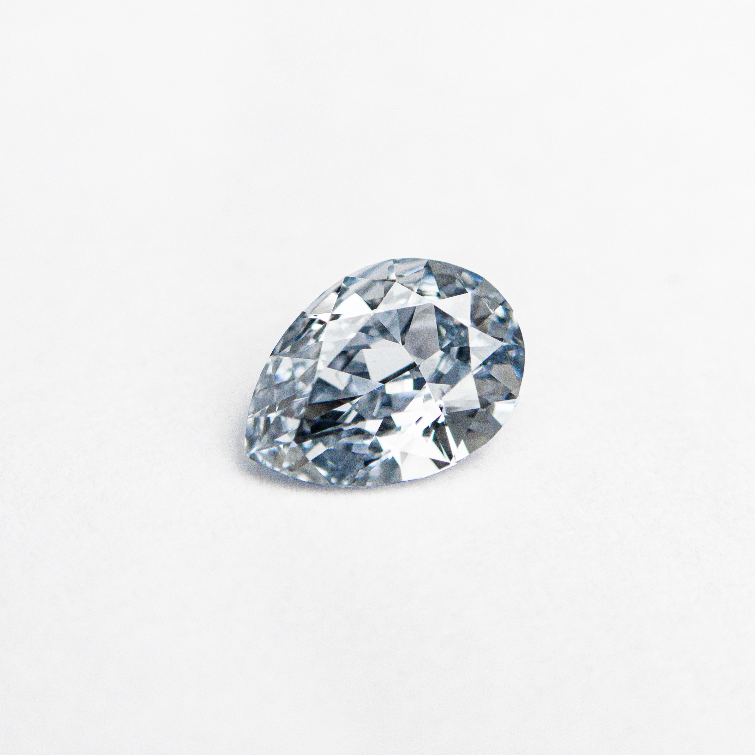 The 0.41ct 6.28x4.48x2.33mm GIA SI1 Fancy Intense Blue Pear Brilliant 24136-01 by East London jeweller Rachel Boston | Discover our collections of unique and timeless engagement rings, wedding rings, and modern fine jewellery.