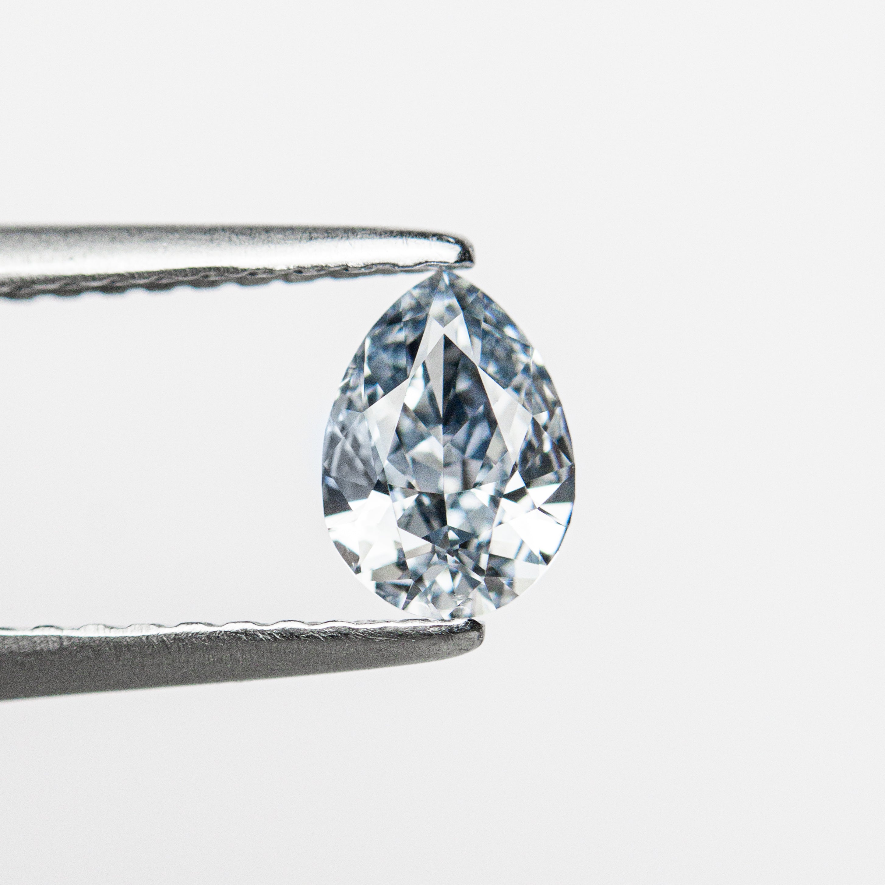 The 0.41ct 6.28x4.48x2.33mm GIA SI1 Fancy Intense Blue Pear Brilliant 24136-01 by East London jeweller Rachel Boston | Discover our collections of unique and timeless engagement rings, wedding rings, and modern fine jewellery.