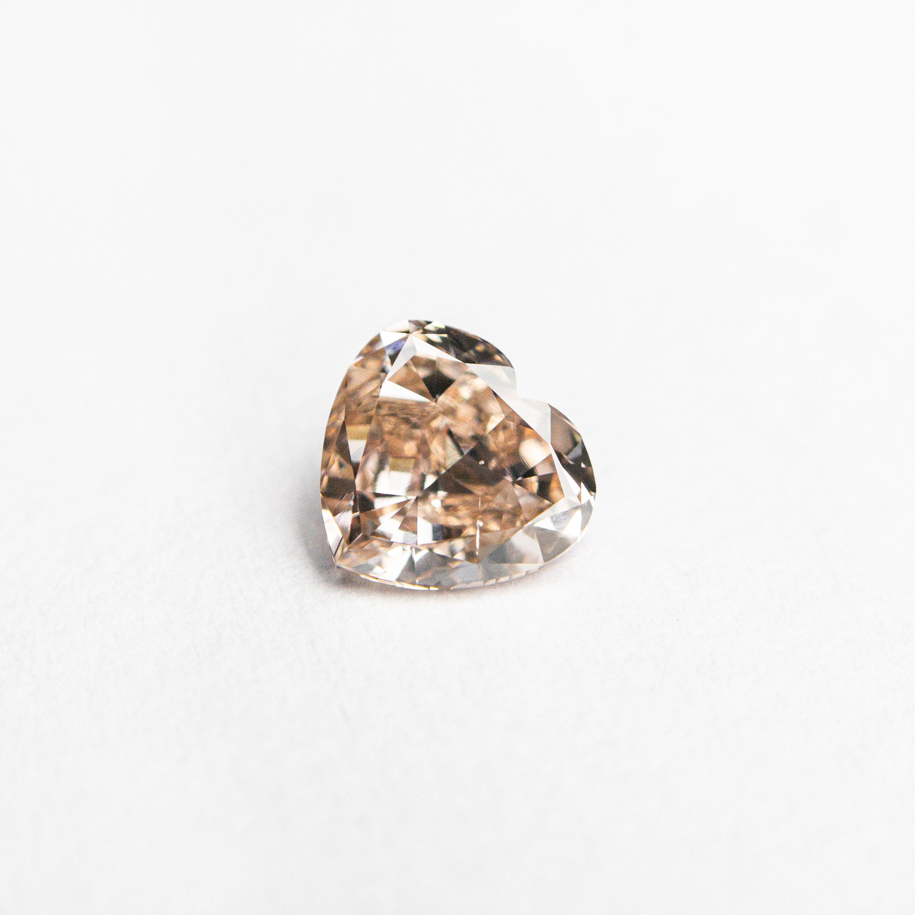 The 0.44ct 4.83x5.16x2.60mm GIA VS2 Fancy Deep Brown-Pink Heart Brilliant 🇦🇺 24154-01 by East London jeweller Rachel Boston | Discover our collections of unique and timeless engagement rings, wedding rings, and modern fine jewellery.