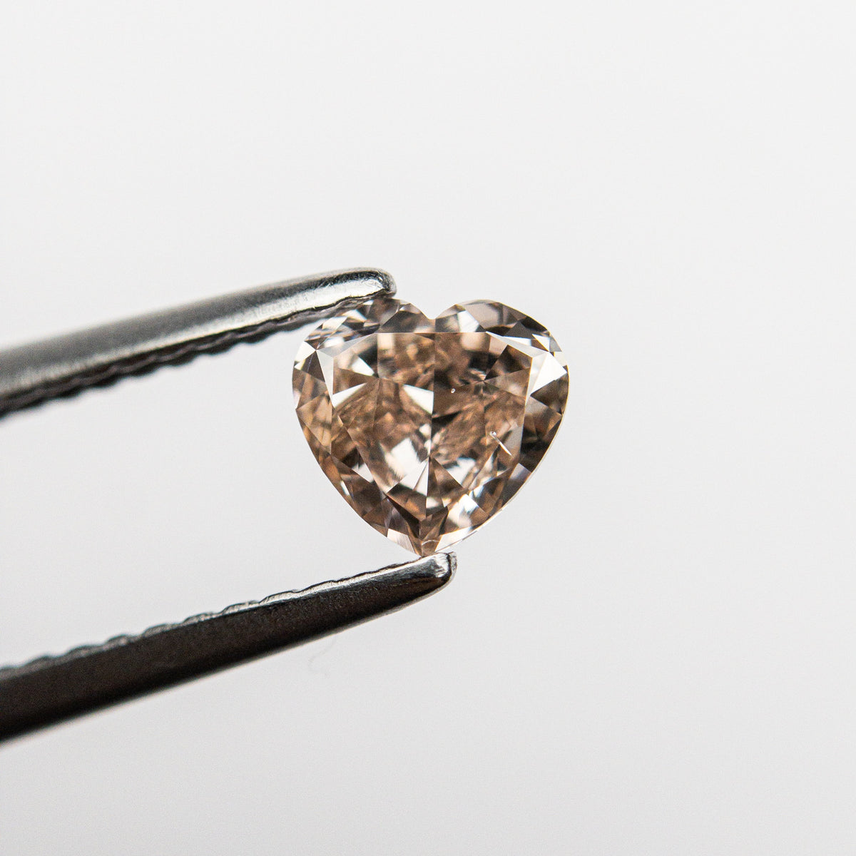 The 0.44ct 4.83x5.16x2.60mm GIA VS2 Fancy Deep Brown-Pink Heart Brilliant 🇦🇺 24154-01 by East London jeweller Rachel Boston | Discover our collections of unique and timeless engagement rings, wedding rings, and modern fine jewellery.