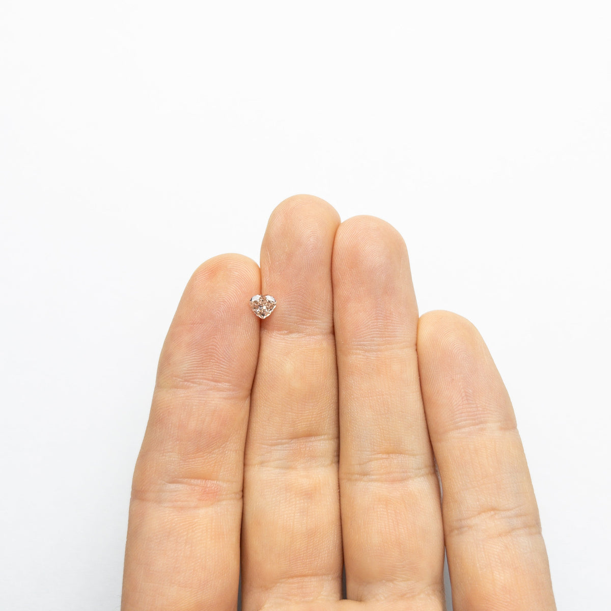 The 0.44ct 4.83x5.16x2.60mm GIA VS2 Fancy Deep Brown-Pink Heart Brilliant 🇦🇺 24154-01 by East London jeweller Rachel Boston | Discover our collections of unique and timeless engagement rings, wedding rings, and modern fine jewellery.