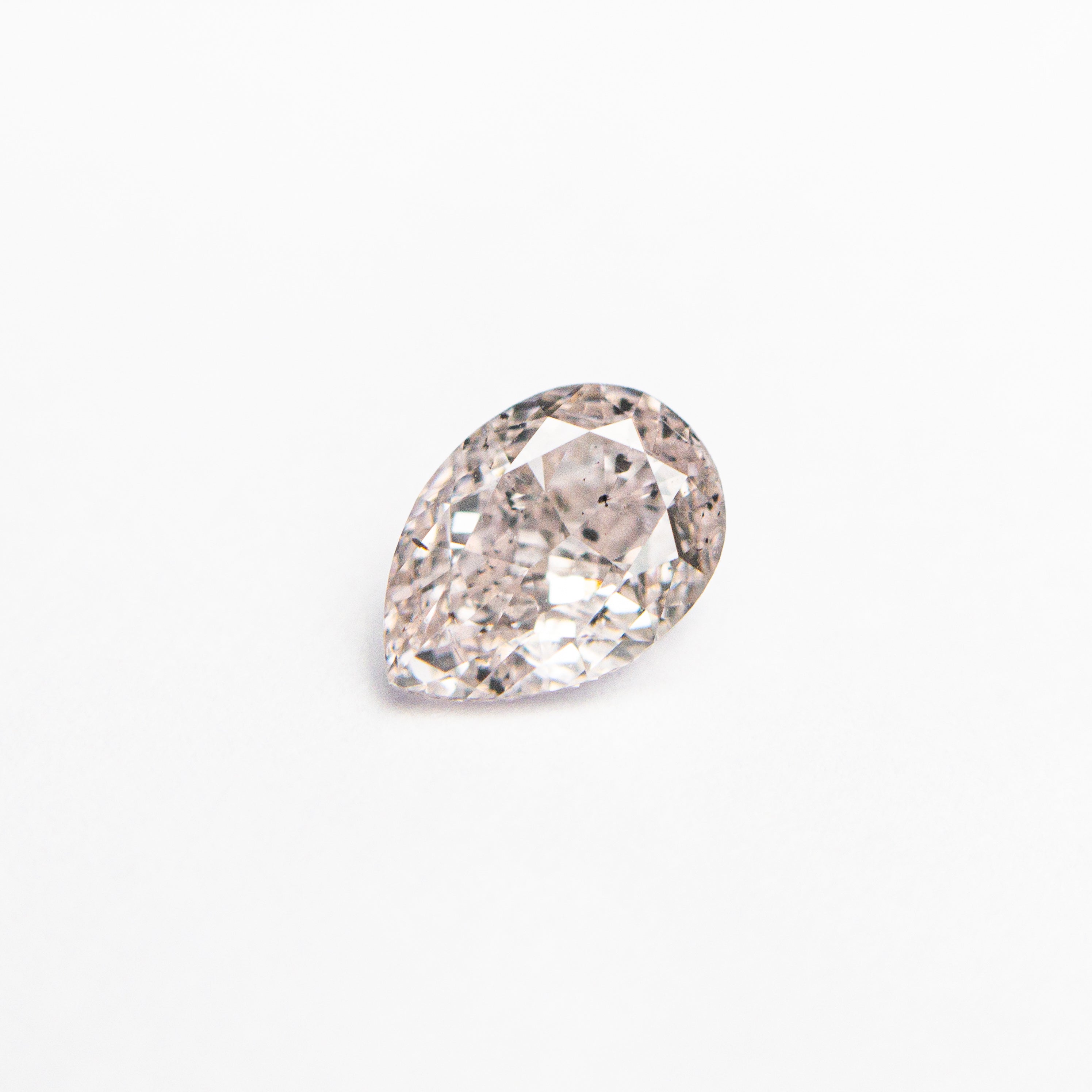 The 0.45ct 5.87x4.07x2.54mm Faint Pink Pear Brilliant 🇦🇺 24117-01 by East London jeweller Rachel Boston | Discover our collections of unique and timeless engagement rings, wedding rings, and modern fine jewellery.